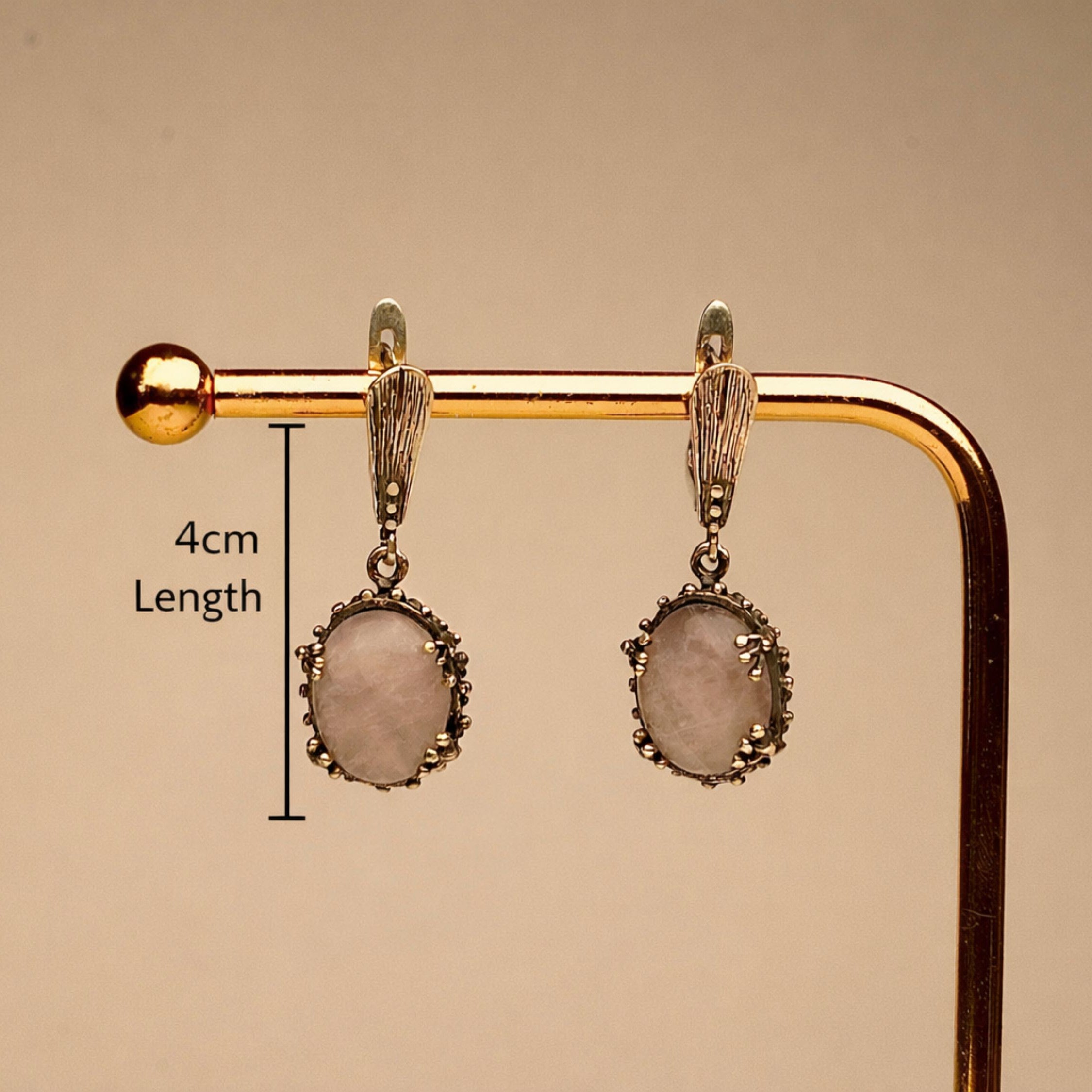 rose quartz earrings in gift box, elegant jewelry packaging ready for gift