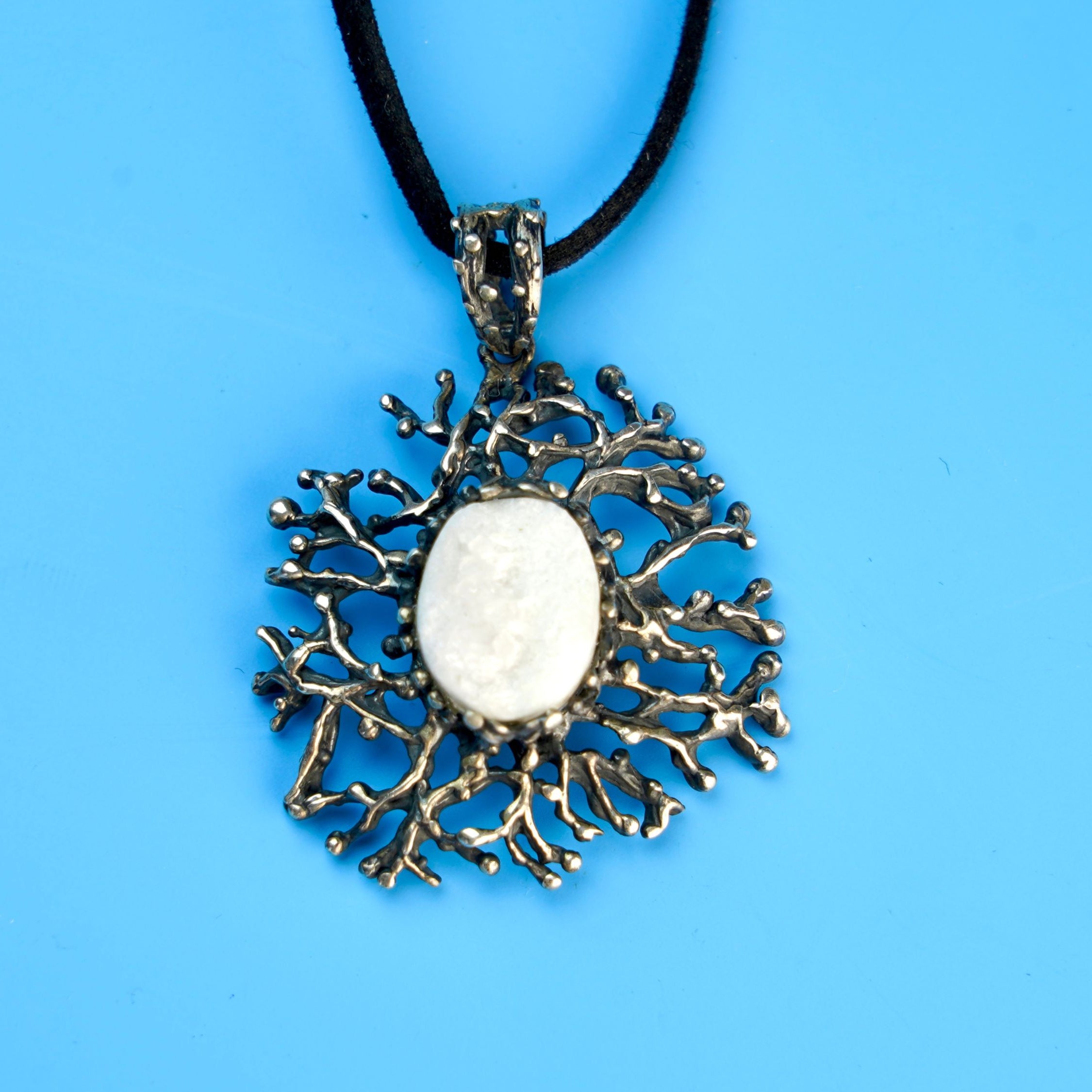 moonstone statement necklace on display, organic silver artistic pendant