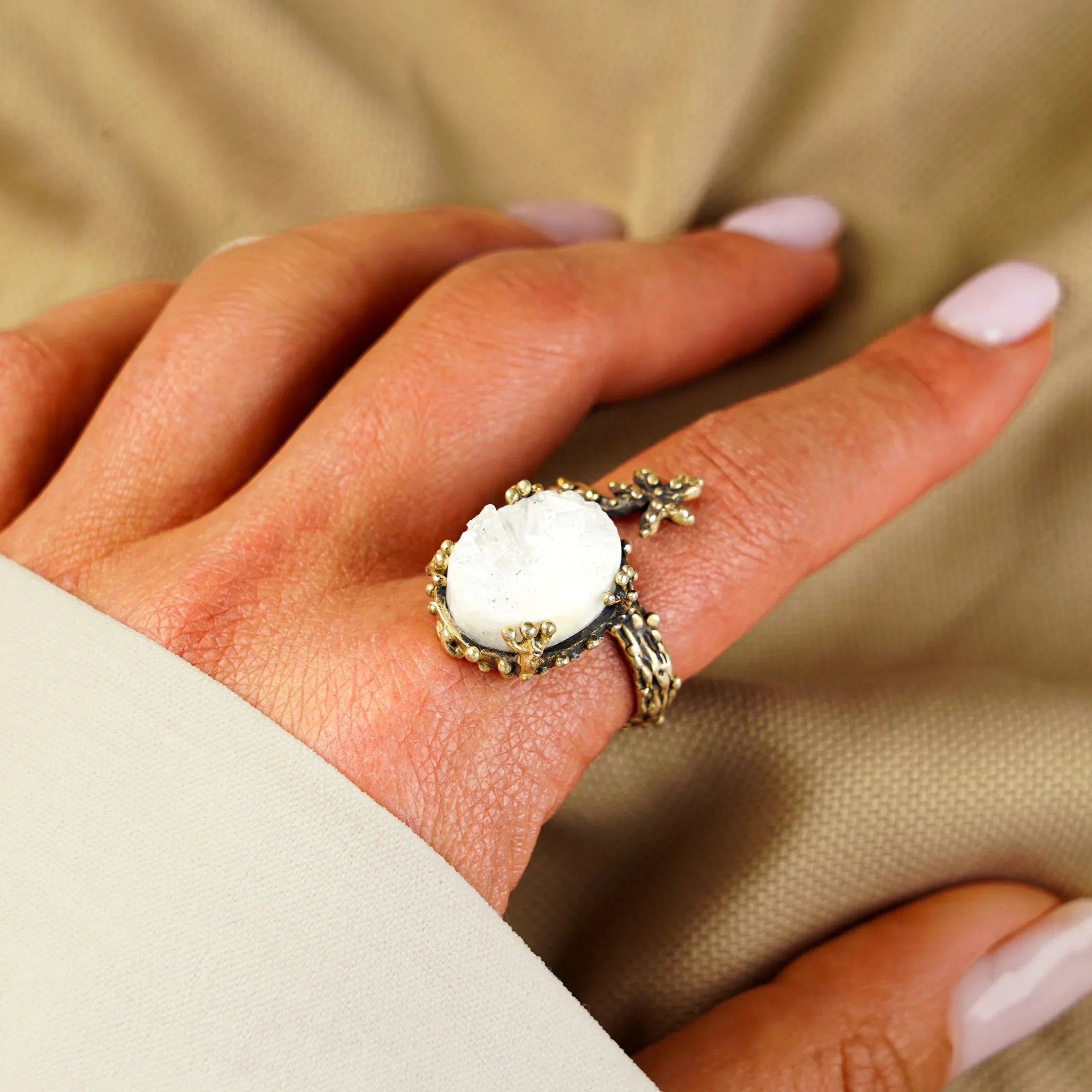 Moonstone ring worn on hand adjustable sterling silver glowing gemstone