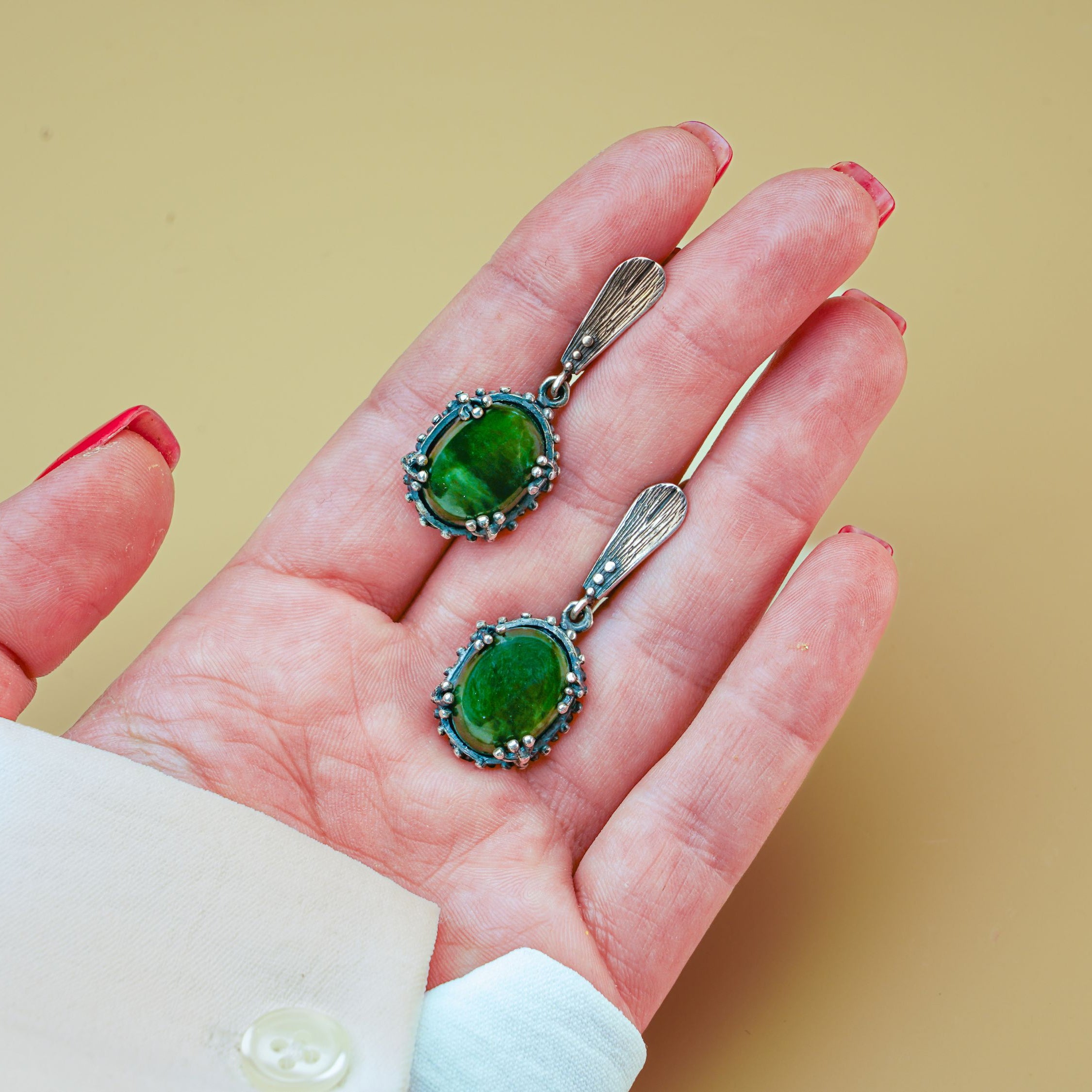 Jade earrings on hand size reference green gemstone silver earrings