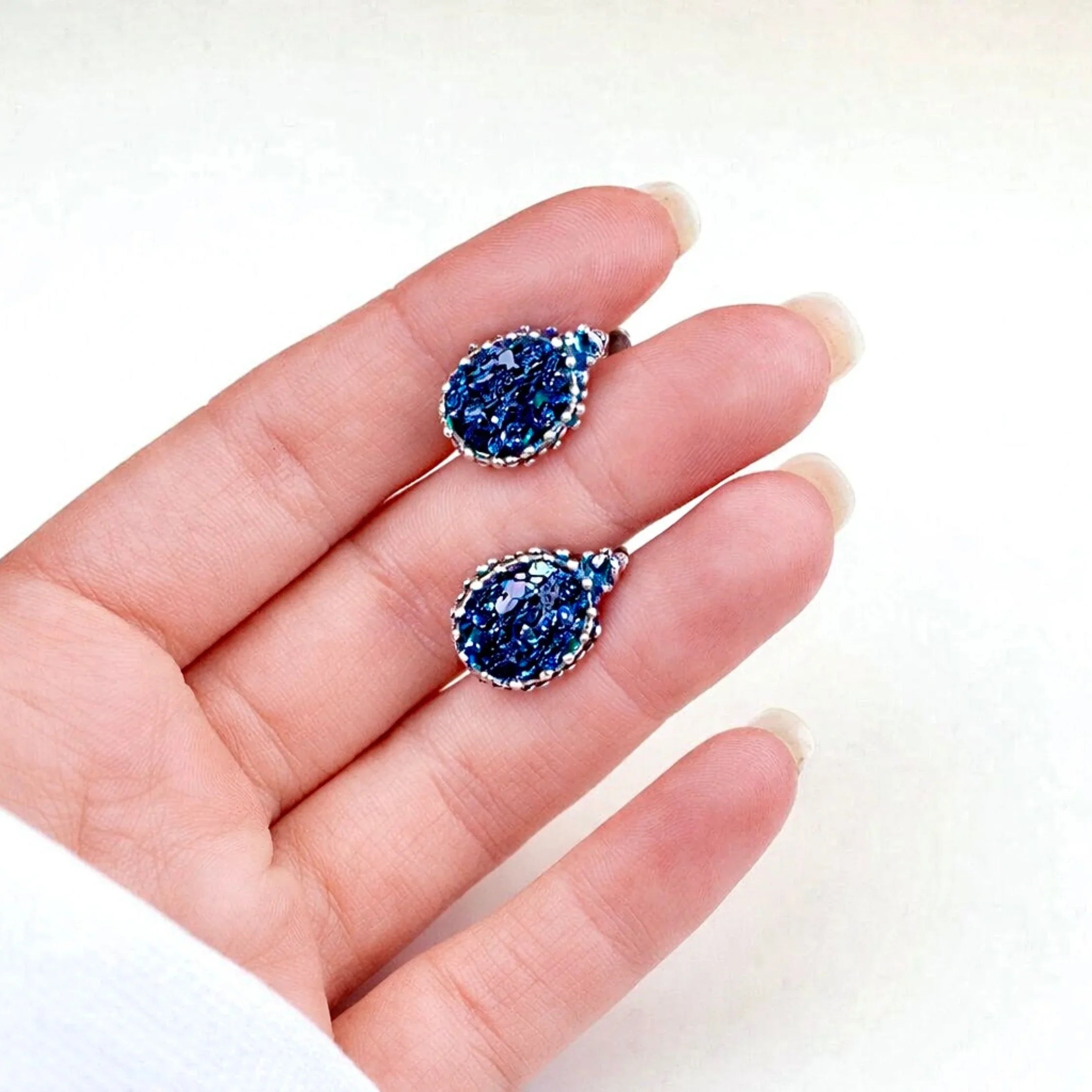 Black moissanite earrings on hand size reference sterling silver leverback