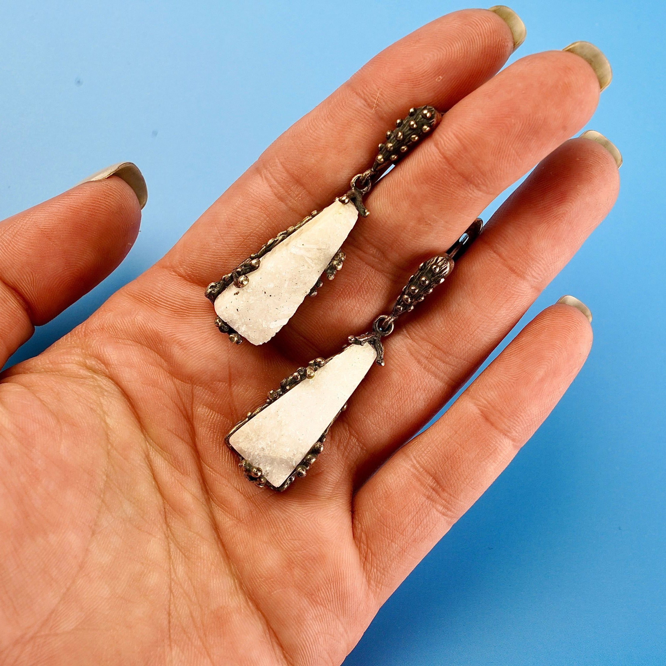 Moonstone earrings on hand size reference raw white crystal silver earrings
