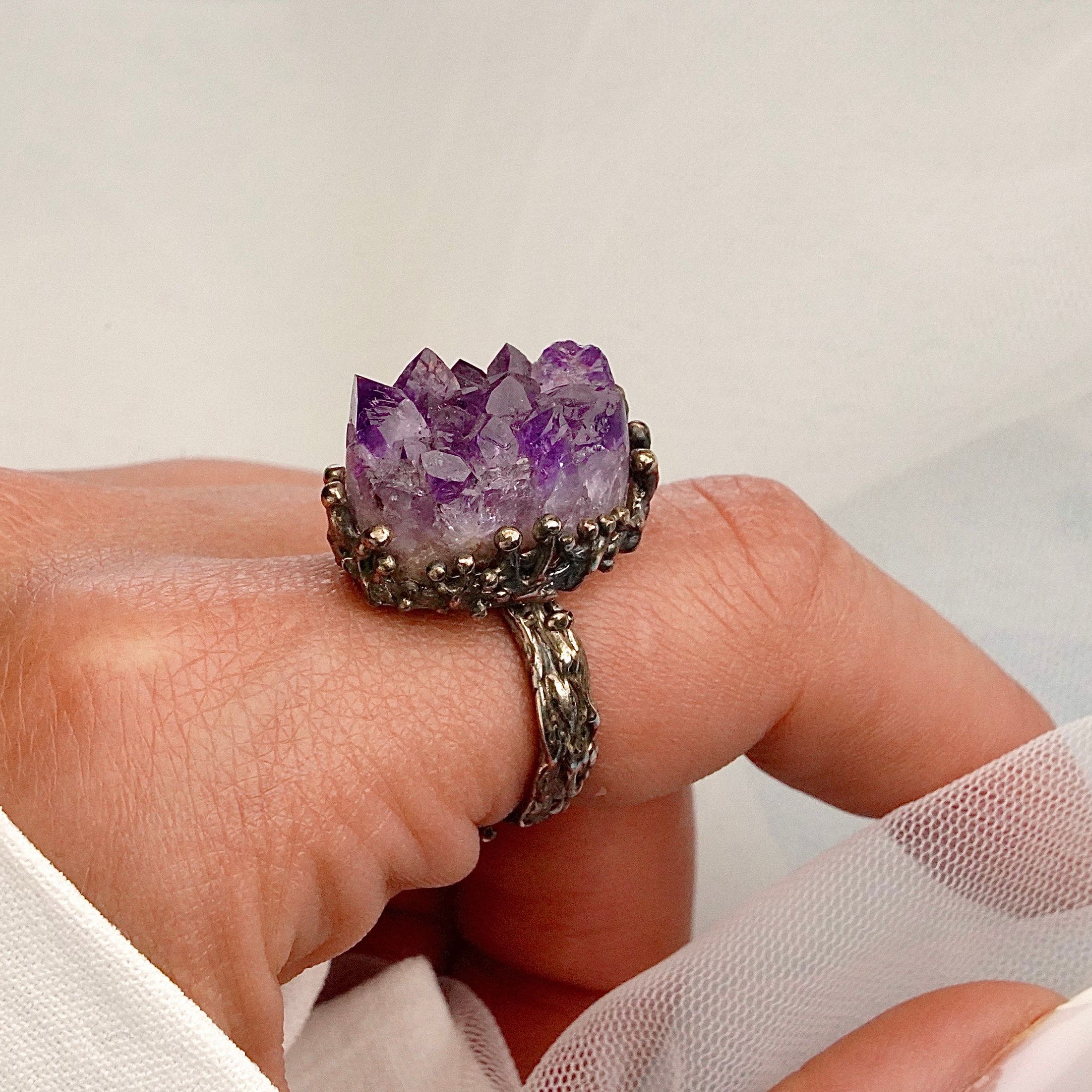 Amethyst adjustable ring on hand size reference raw purple gemstone silver ring bold style