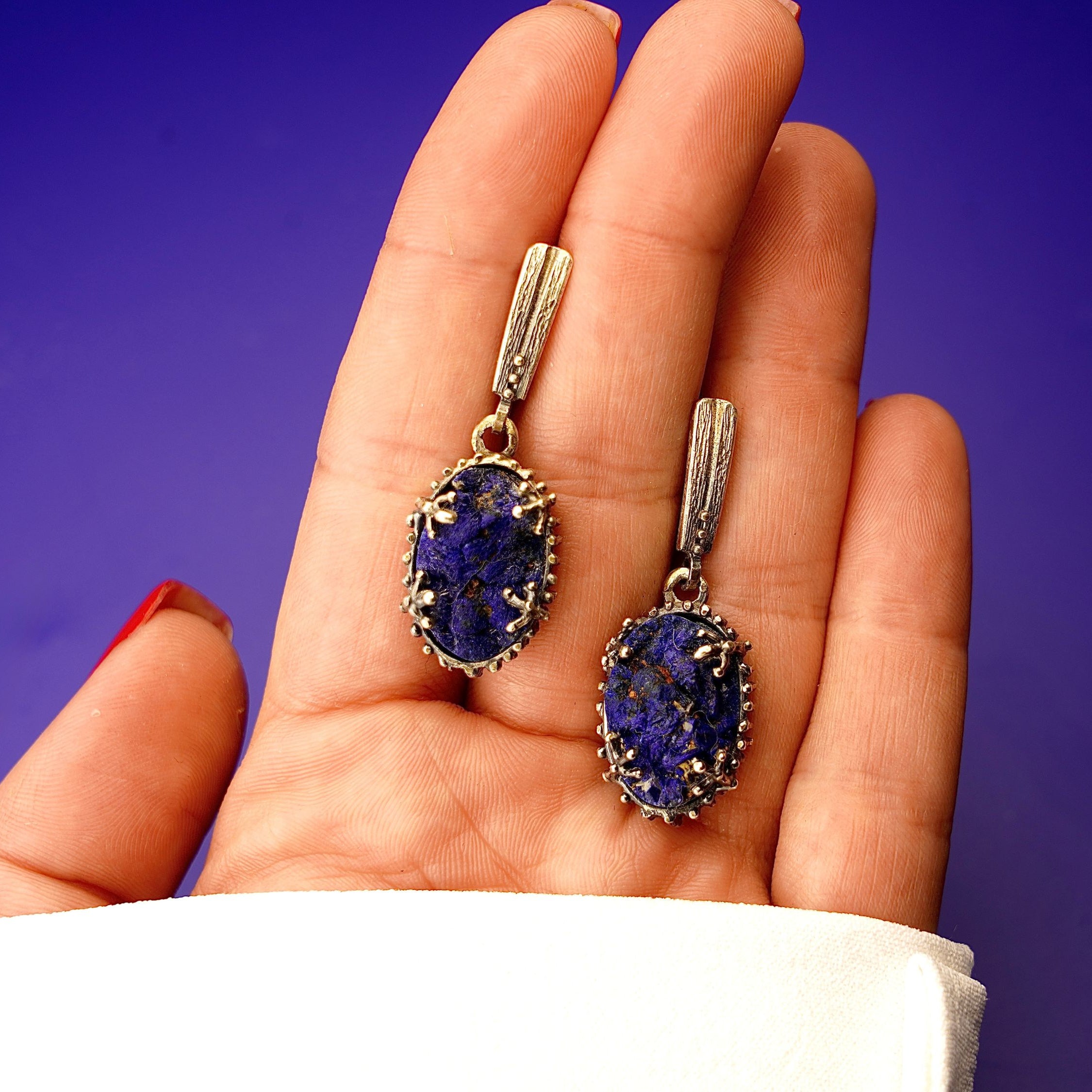 Lapis lazuli earrings on hand size reference blue gemstone silver earrings