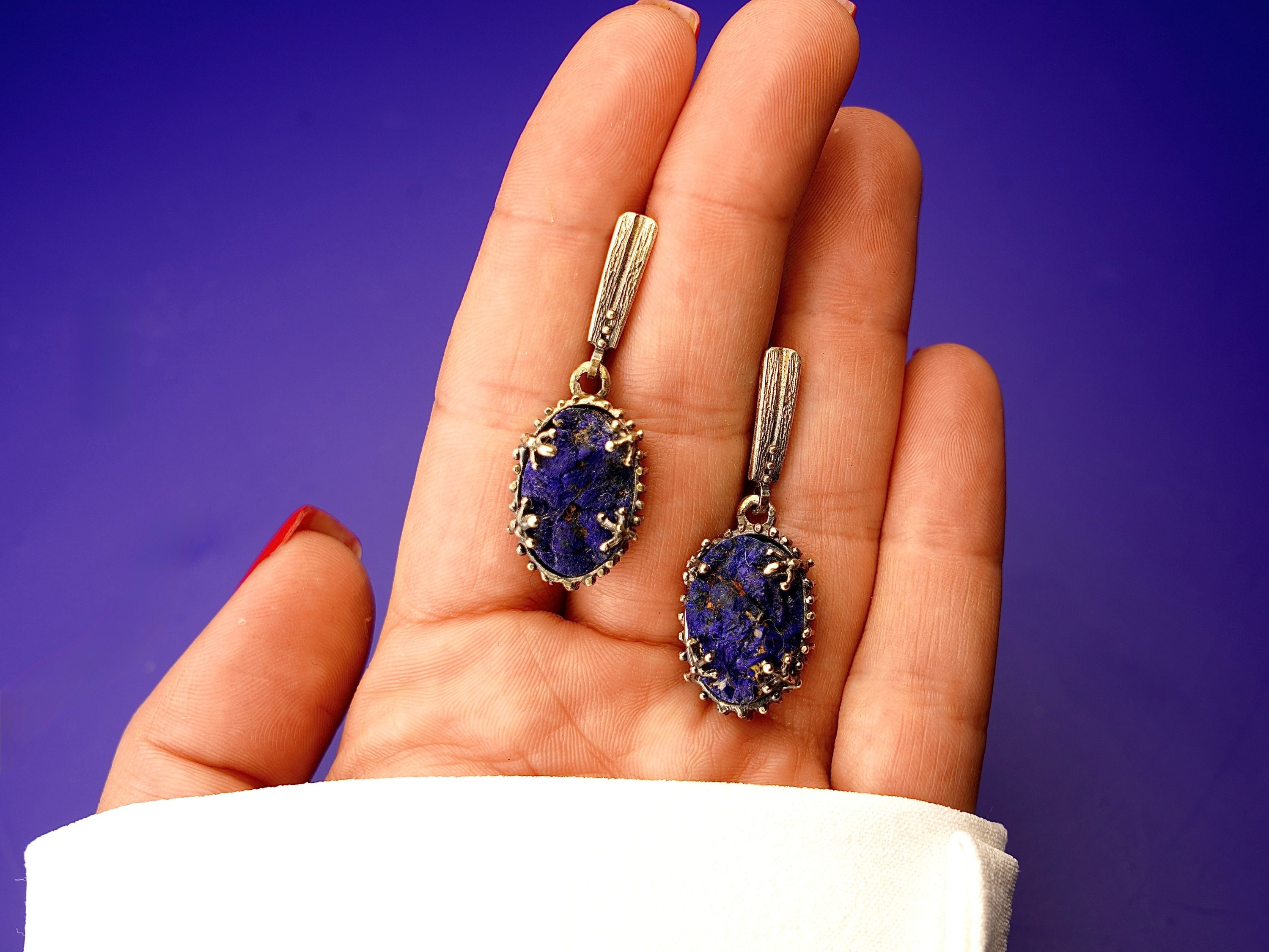 Lapis lazuli earrings on hand size reference blue gemstone silver earrings