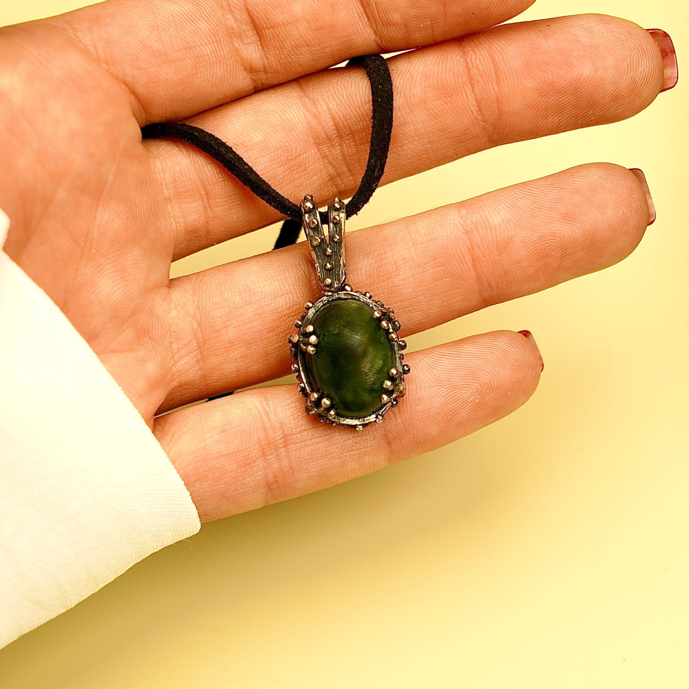 jade necklace on hand size reference green stone pendant