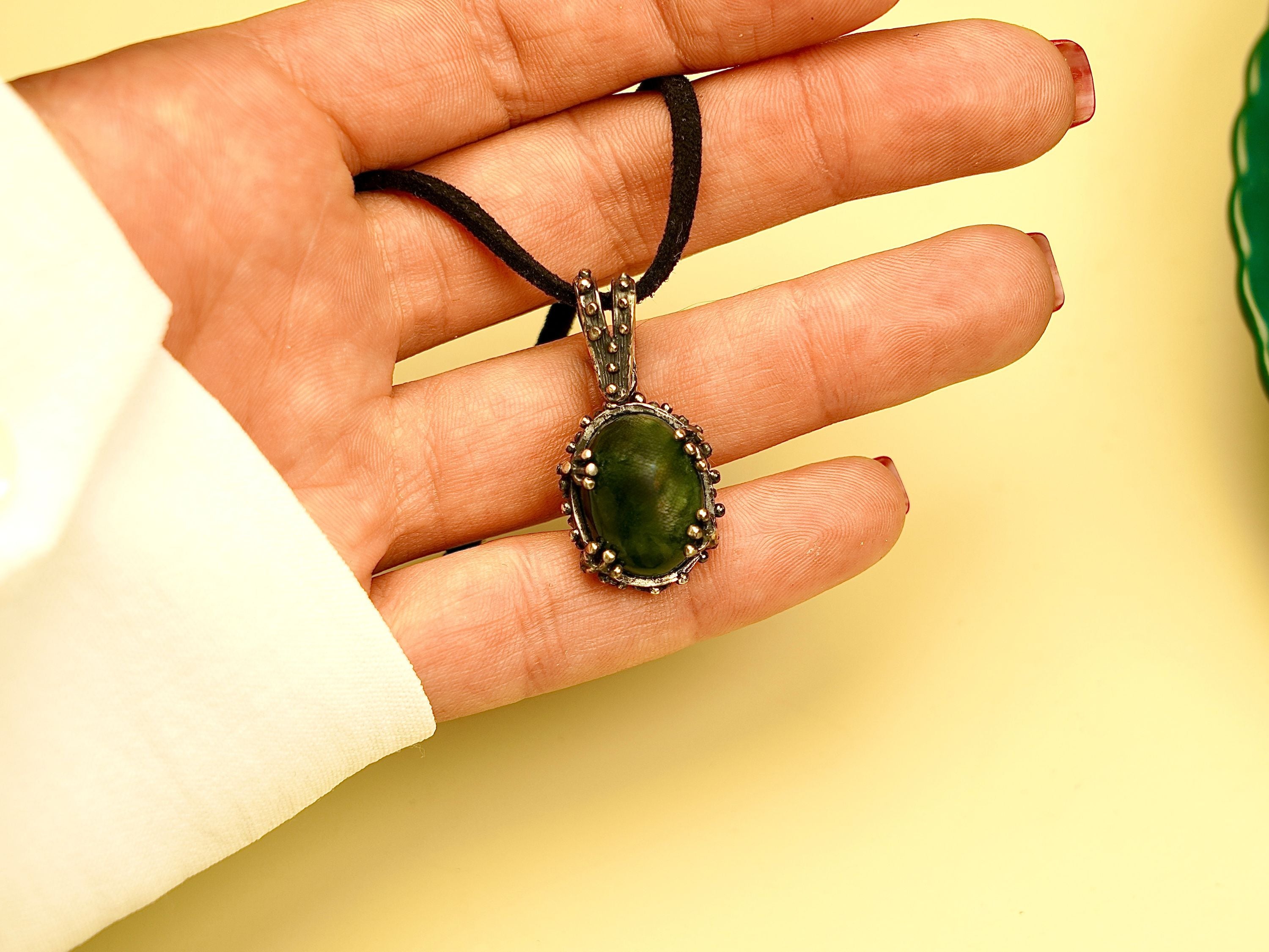 jade necklace on hand size reference green stone pendant