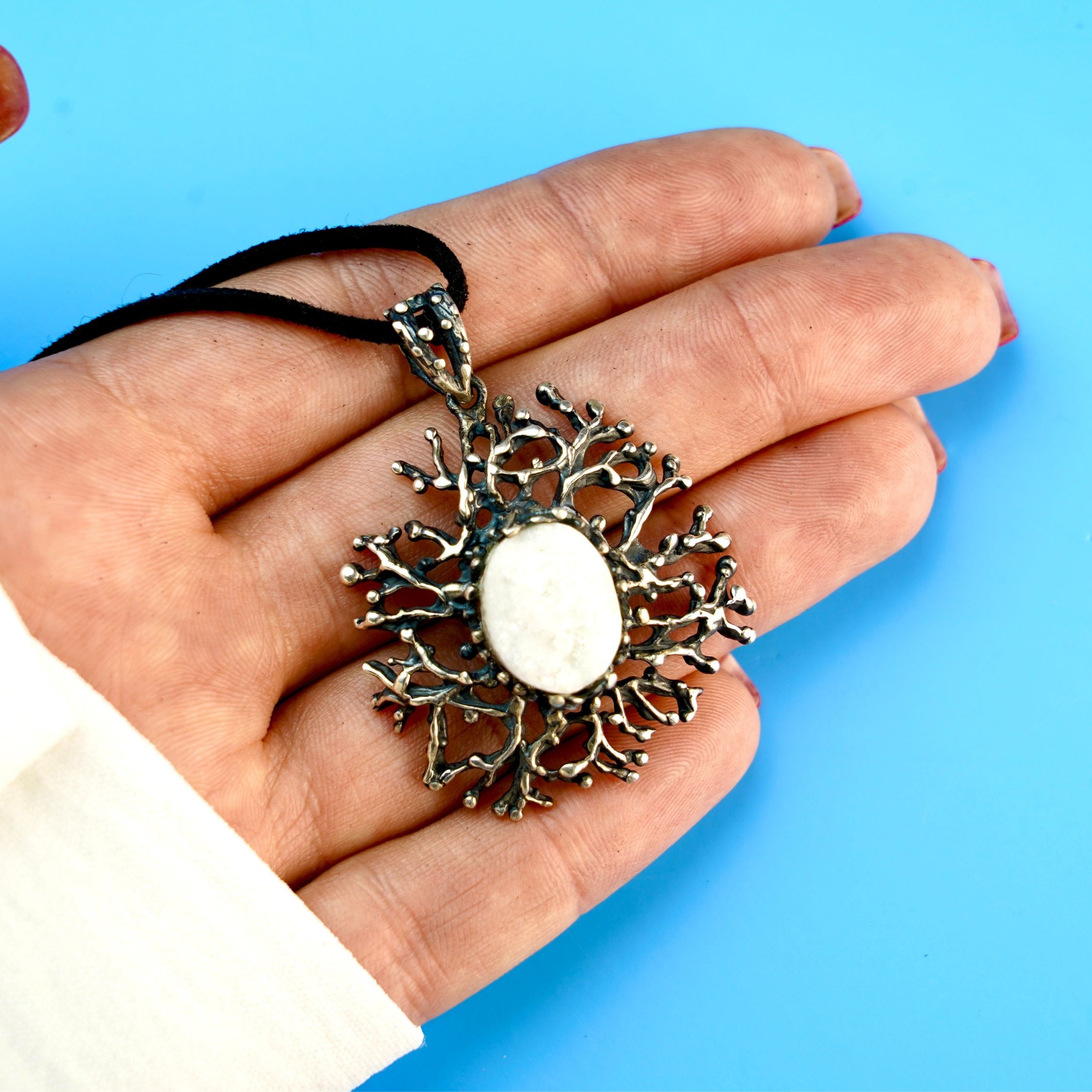 moonstone statement necklace on hand, size reference large artistic pendant