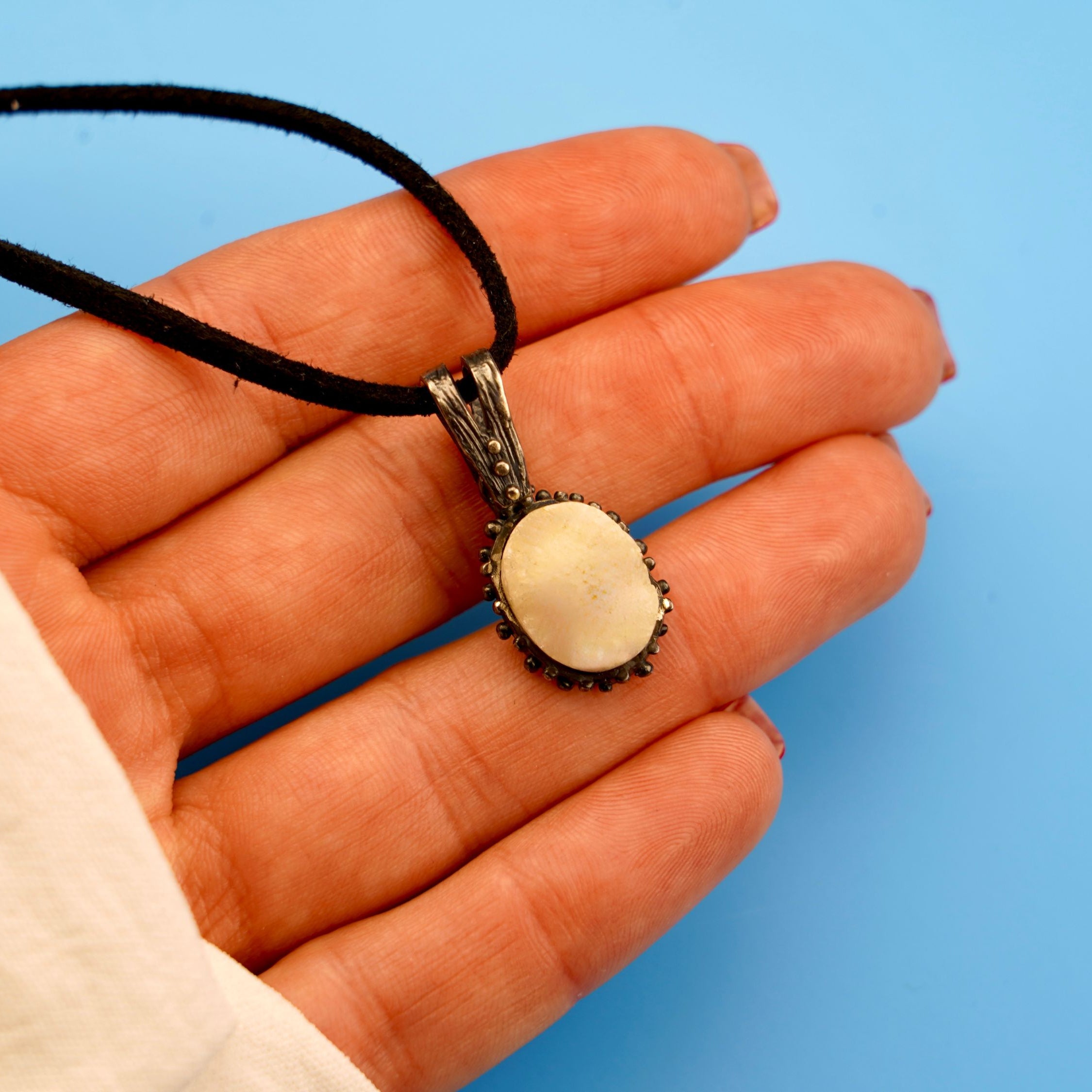 moonstone necklace on hand glowing pendant silver jewelry