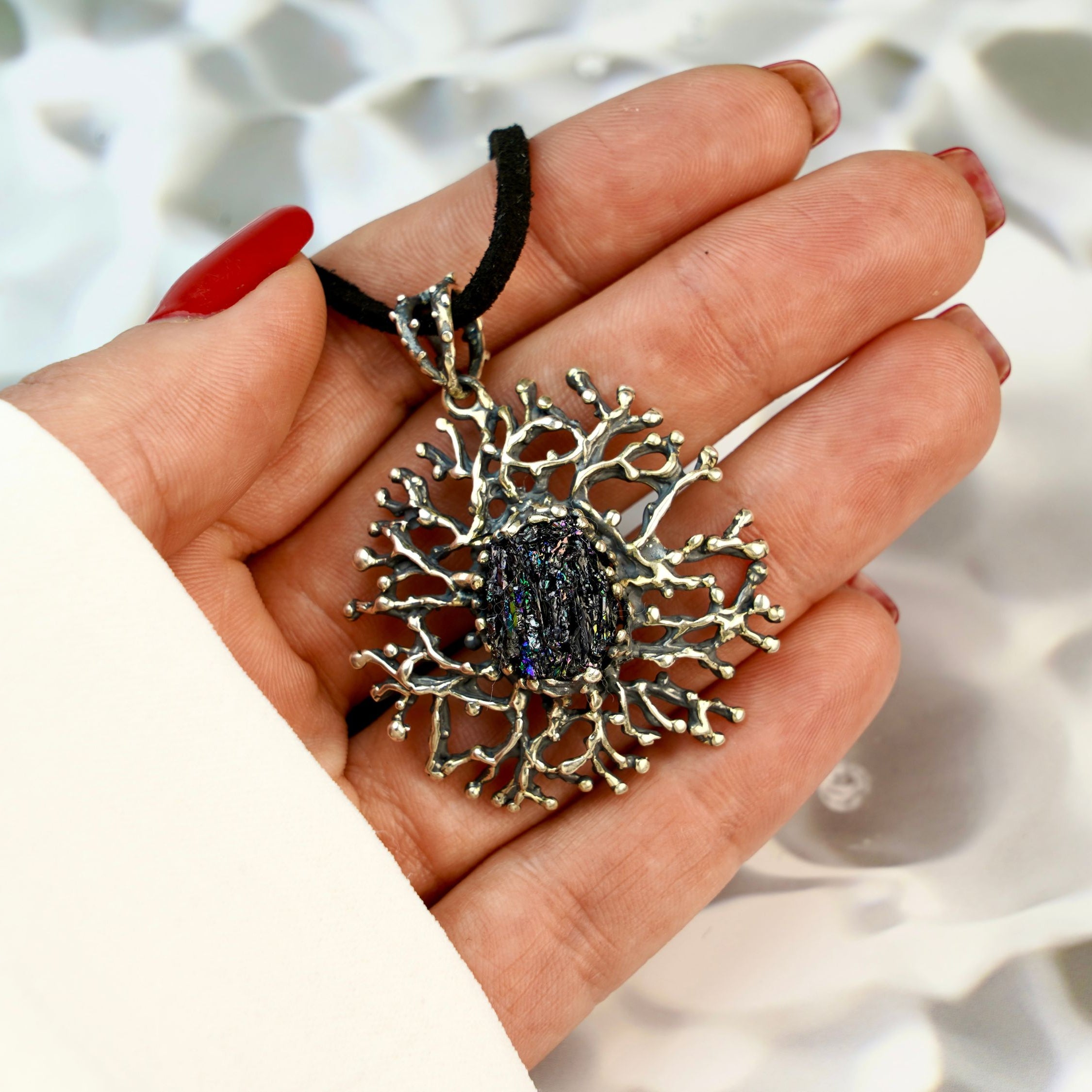 tourmaline pendant necklace on hand, size reference dark gemstone jewelry