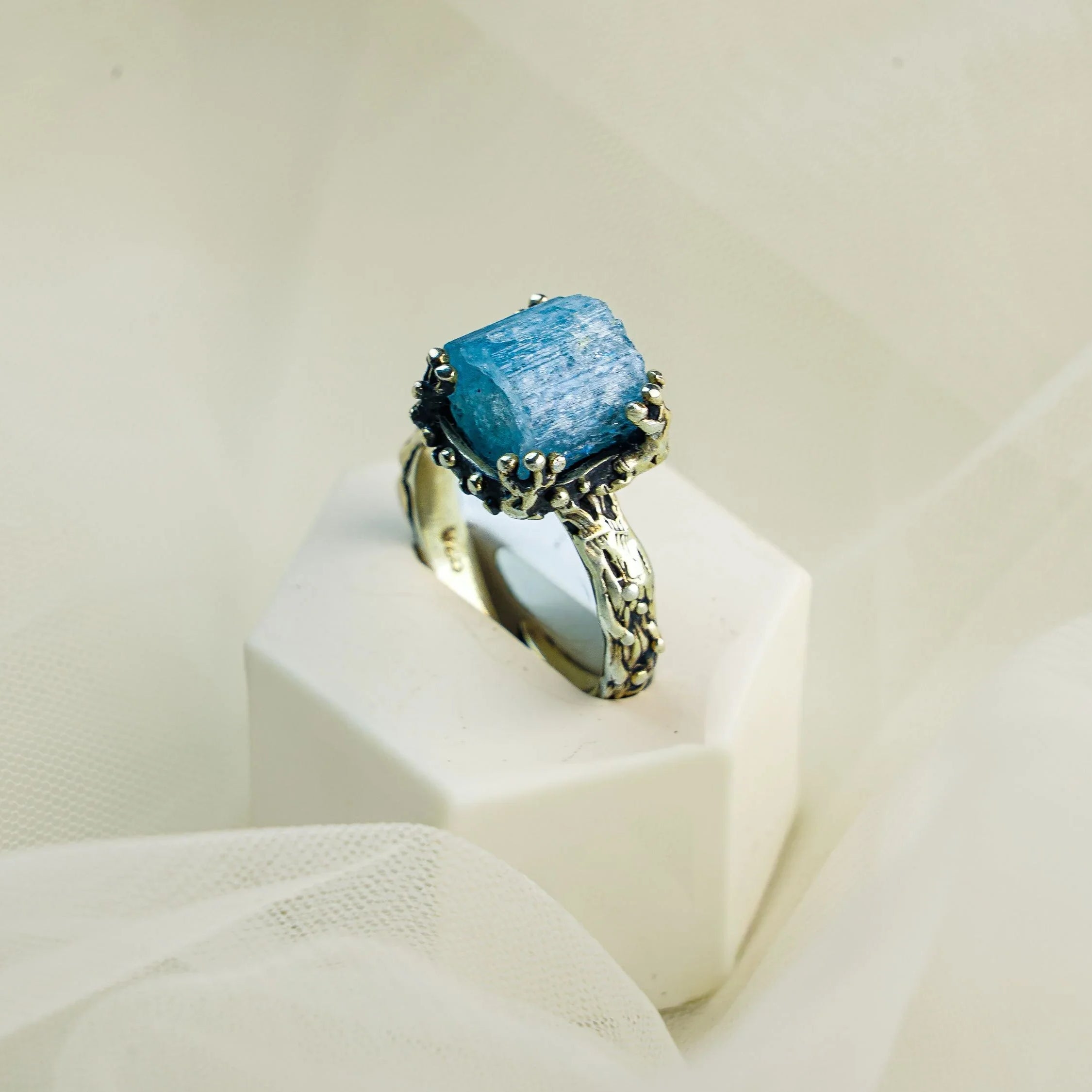 Aquamarine ring angled view sterling silver adjustable blue gemstone ring