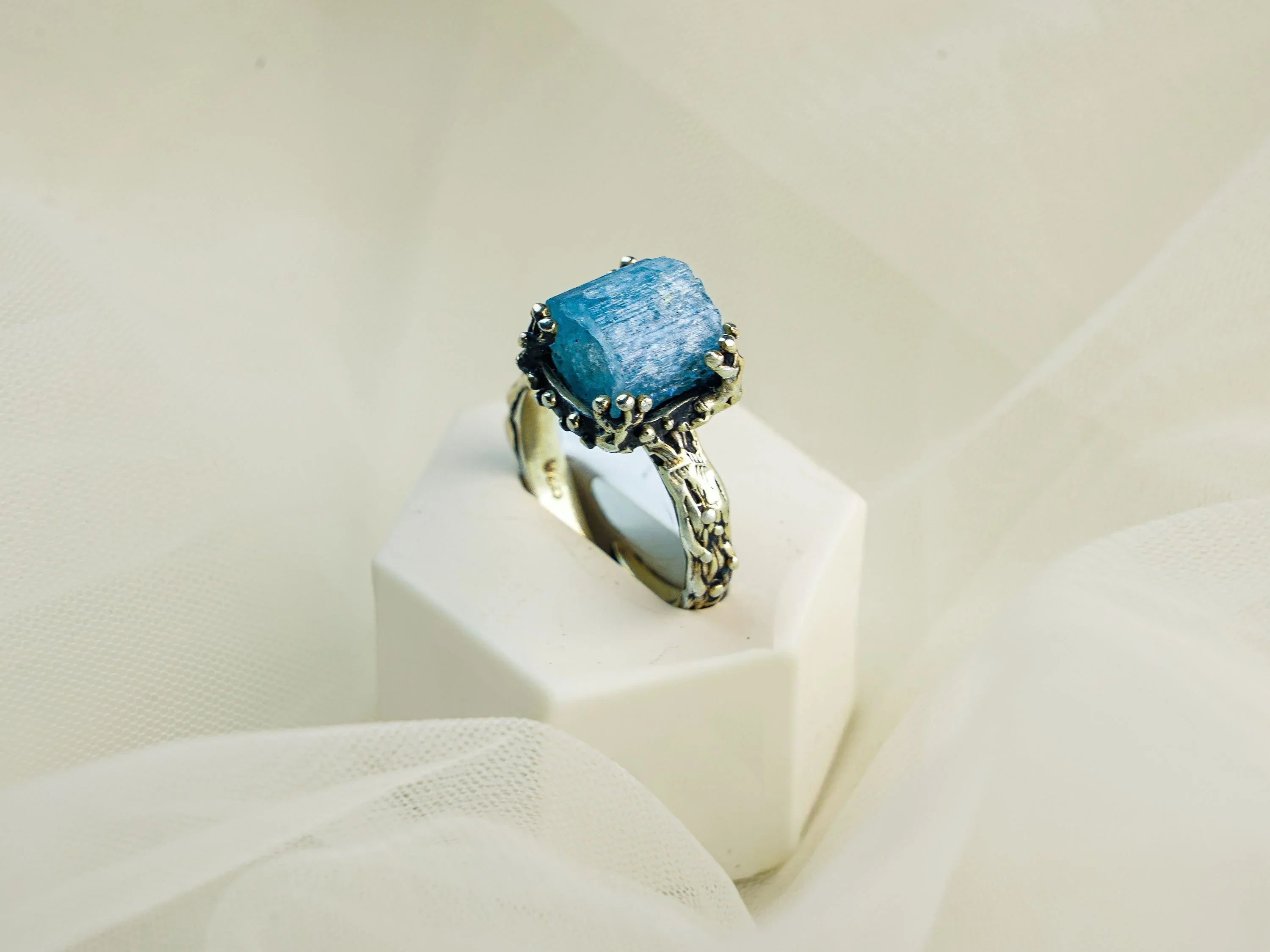 Aquamarine ring angled view sterling silver adjustable blue gemstone ring
