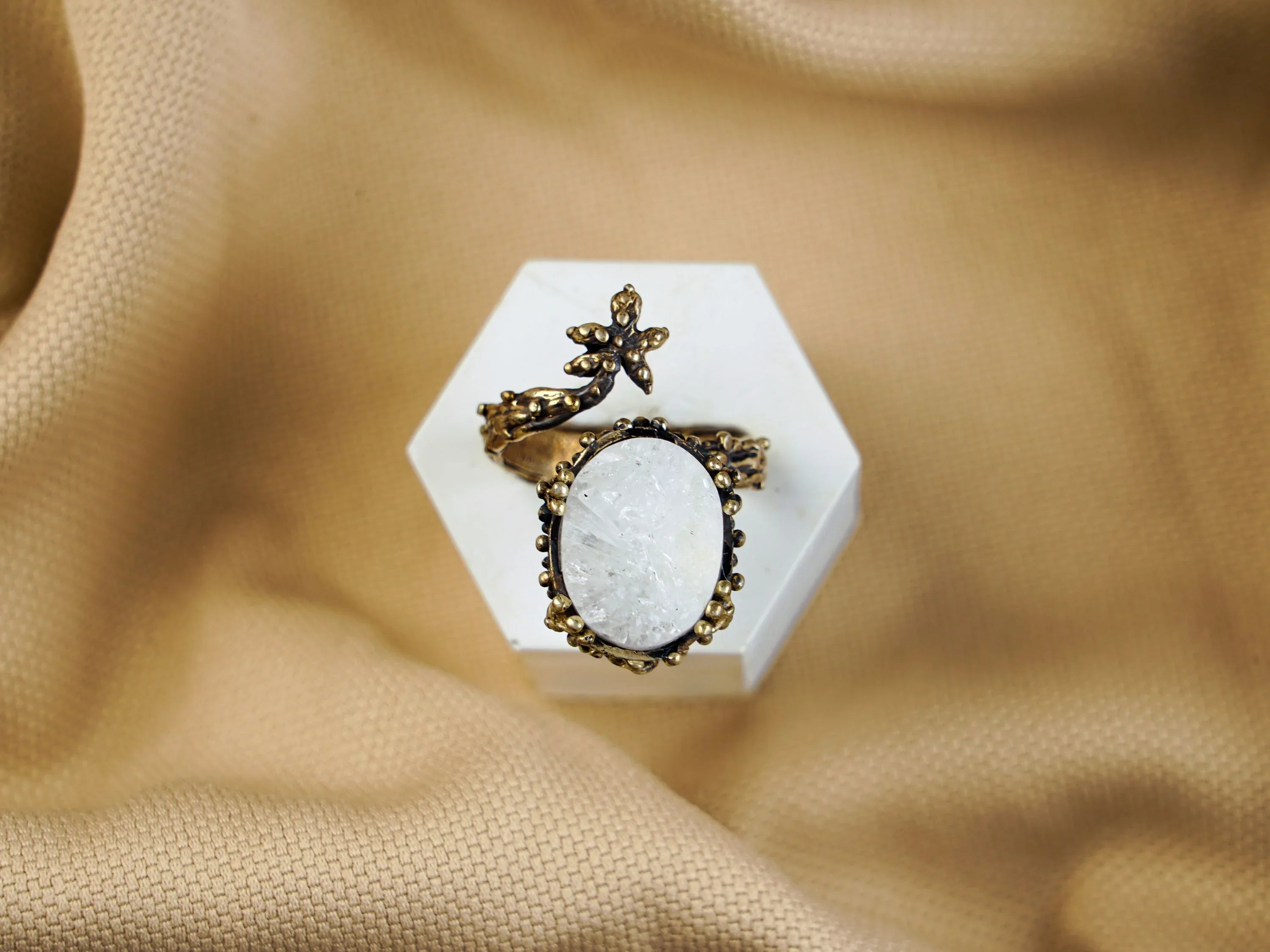 Moonstone ring centered view white glowing stone sterling silver adjustable