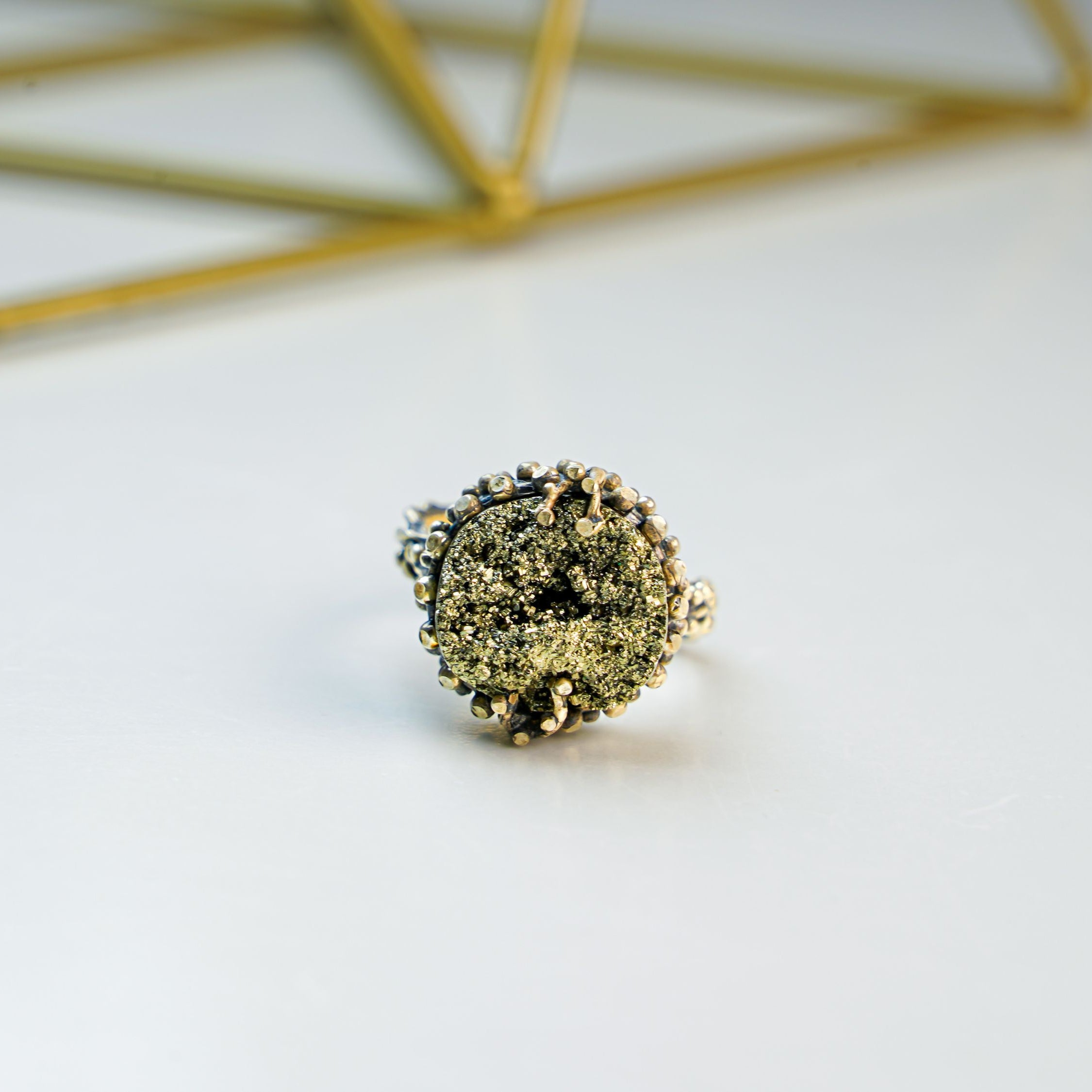 Pyrite ring close up raw gold metallic texture natural stone sterling silver ring