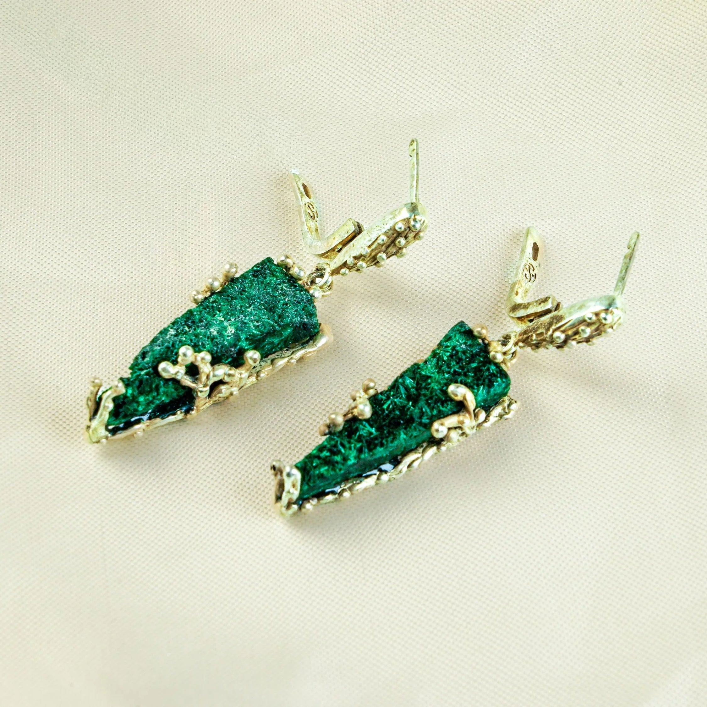 Malachite earrings angled view natural green texture statement jewelry