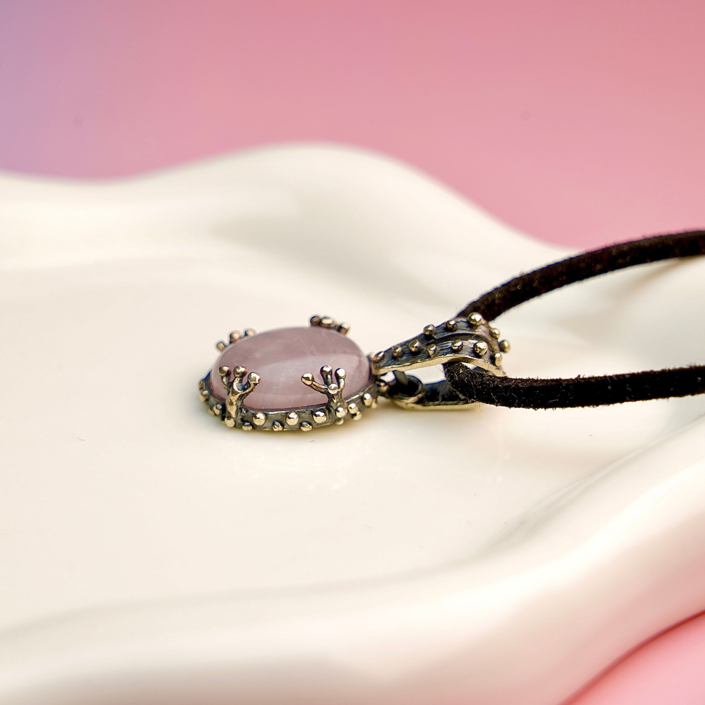 Rose quartz necklace close up detail soft pink gemstone texture sterling silver