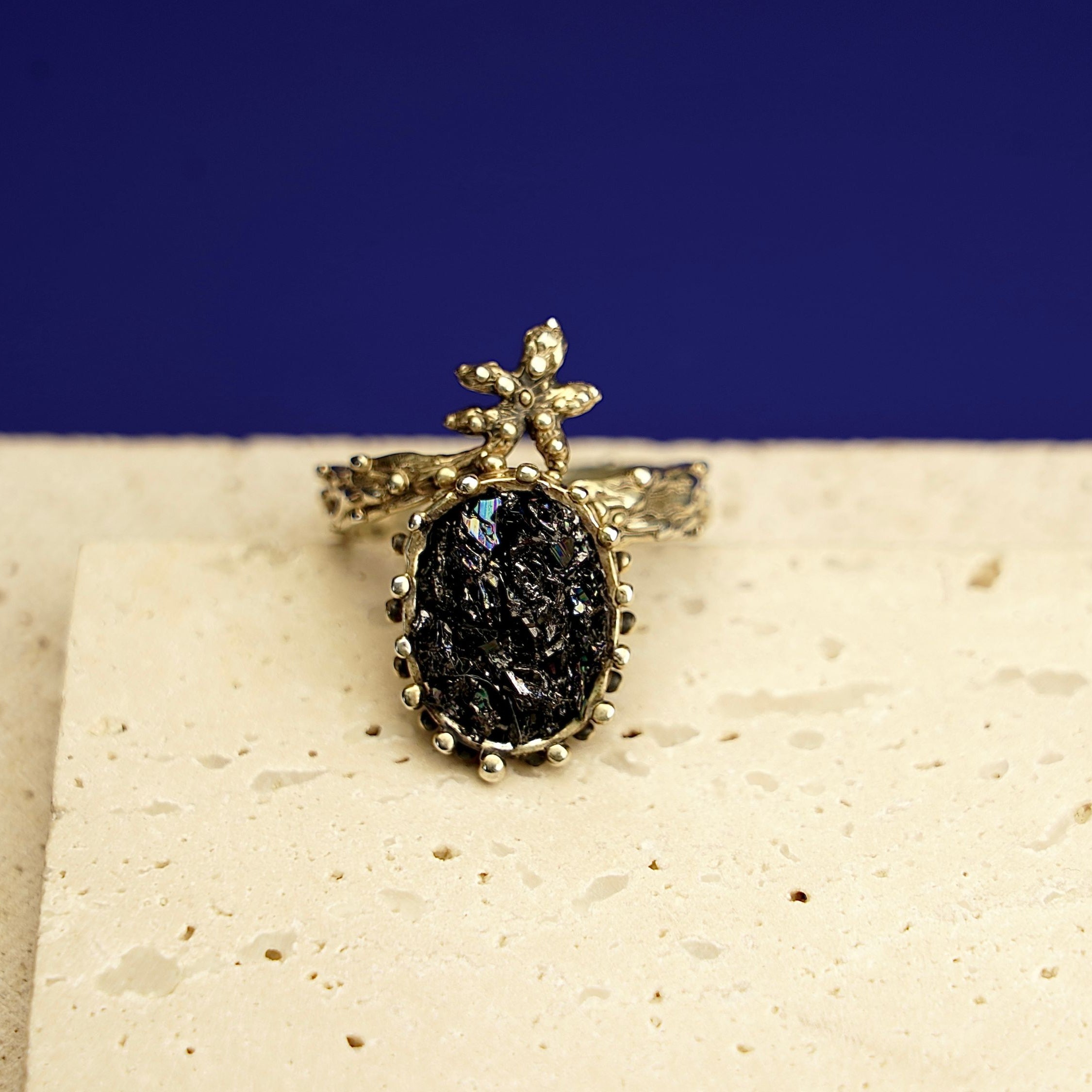 Close up black tourmaline raw gemstone texture detail sterling silver ring