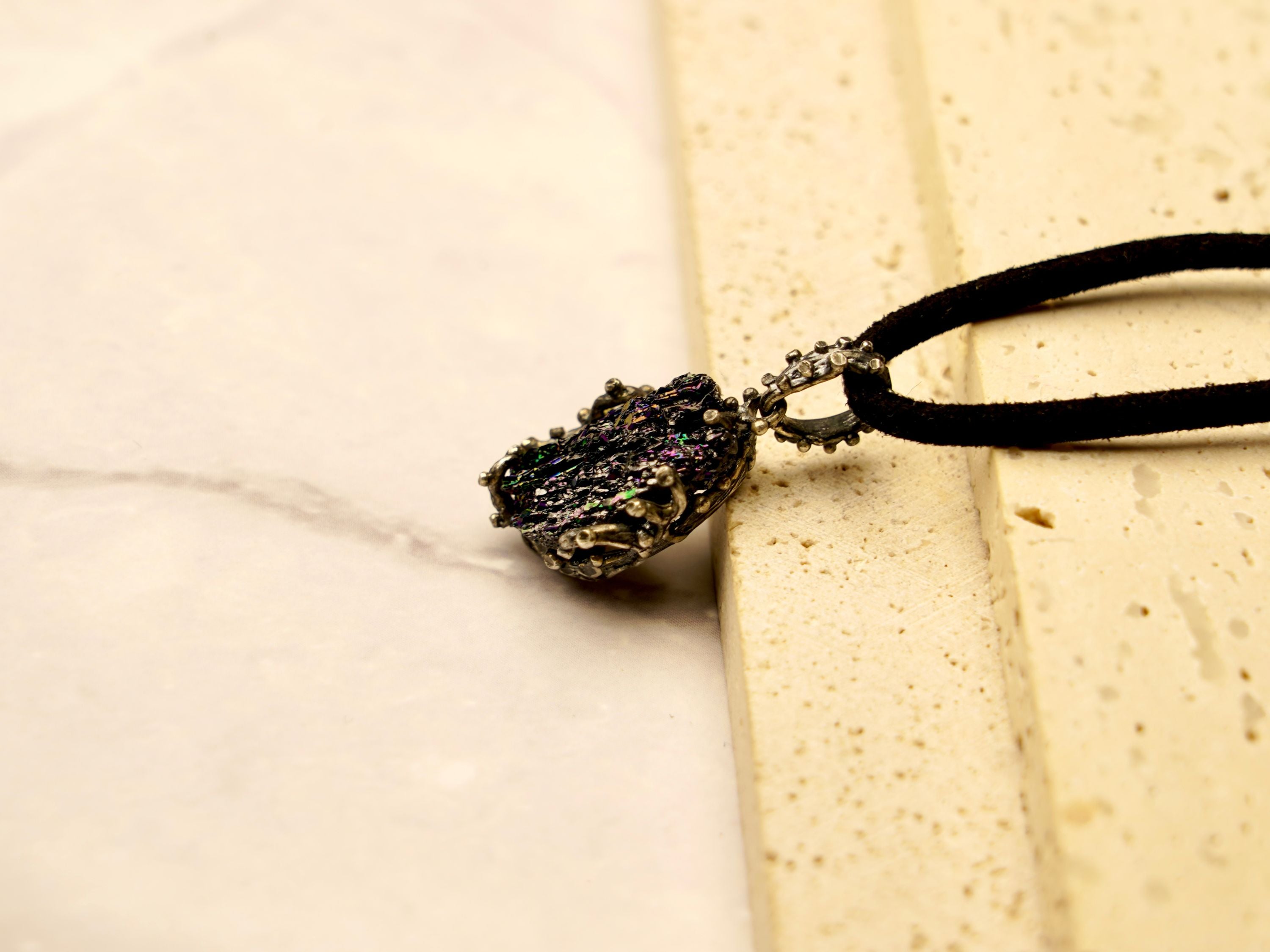 black tourmaline raw crystal close up detail texture sterling silver setting