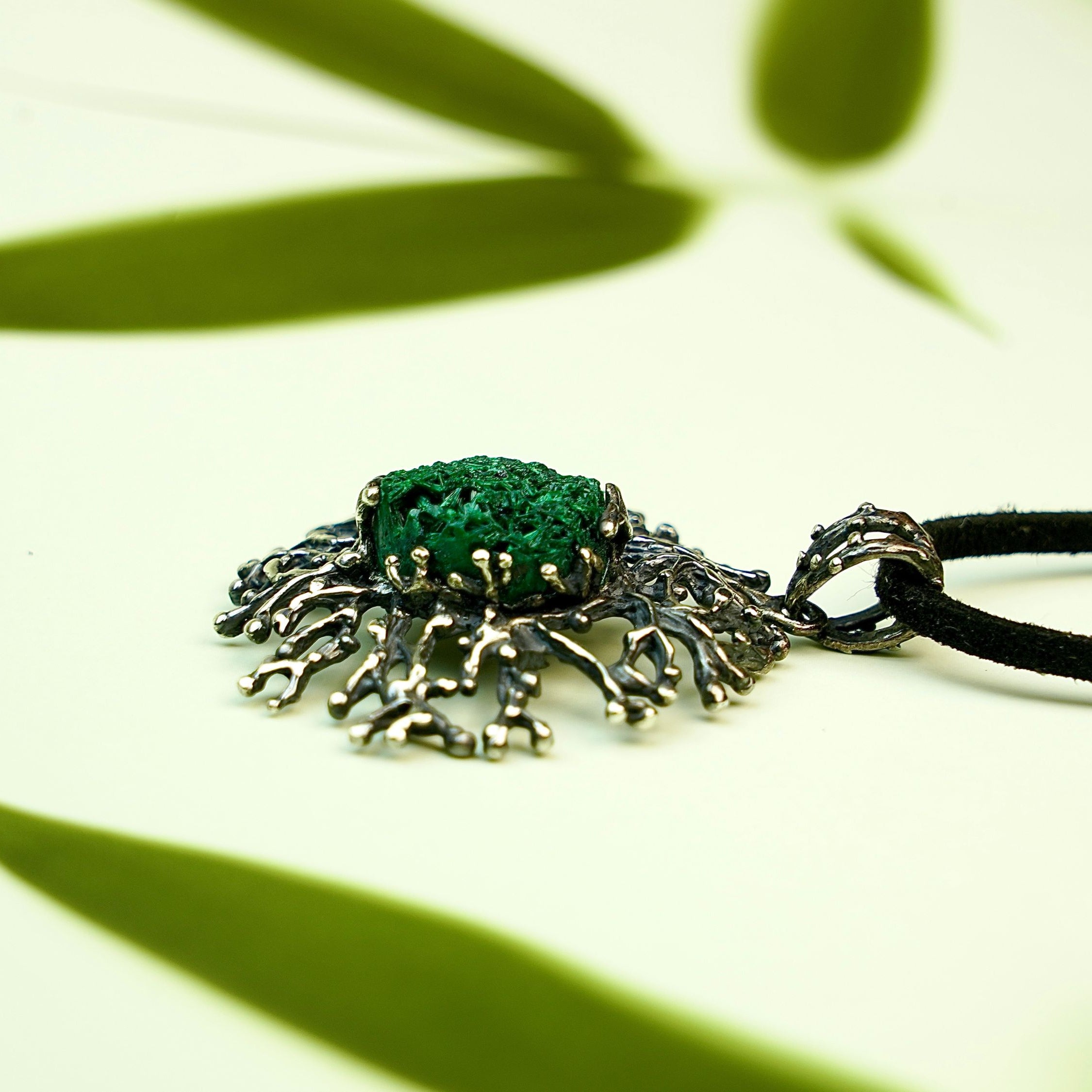 Malachite necklace close up detail green stone texture sterling silver pendant