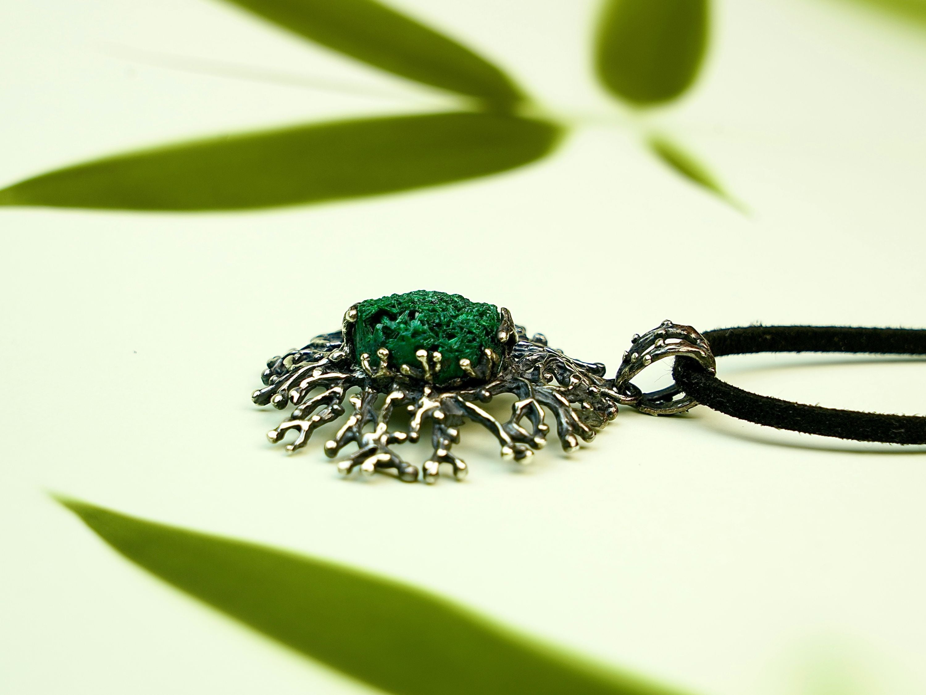 Malachite necklace close up detail green stone texture sterling silver pendant