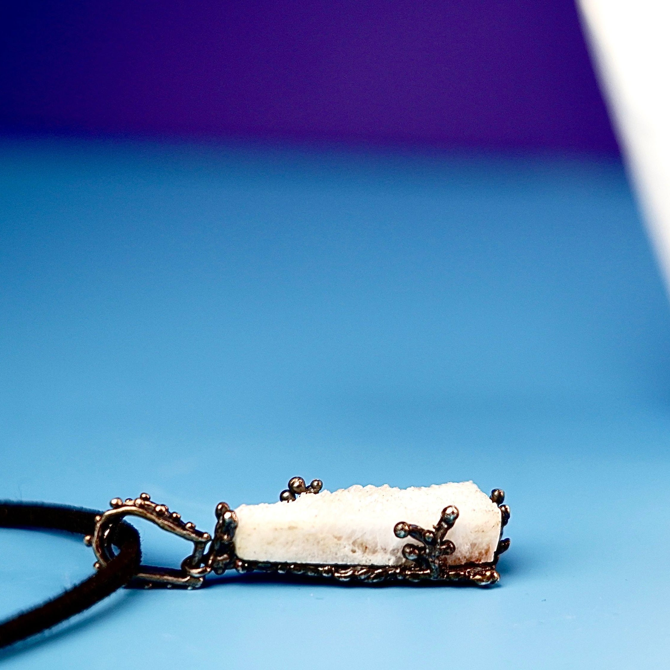 Close up moonstone crystal raw texture white gemstone detail sterling silver pendant