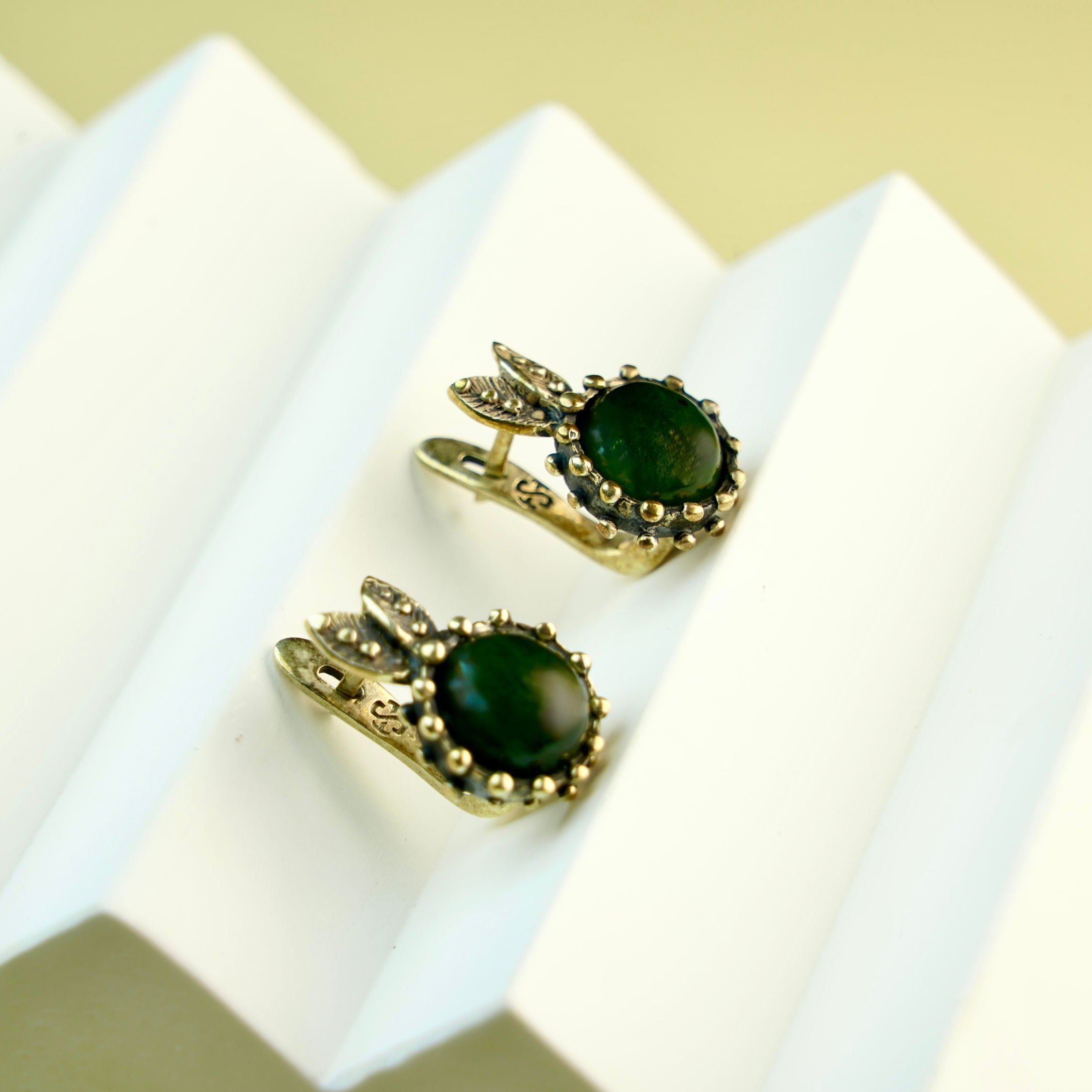 jade earrings angle view green gemstone sterling silver earrings