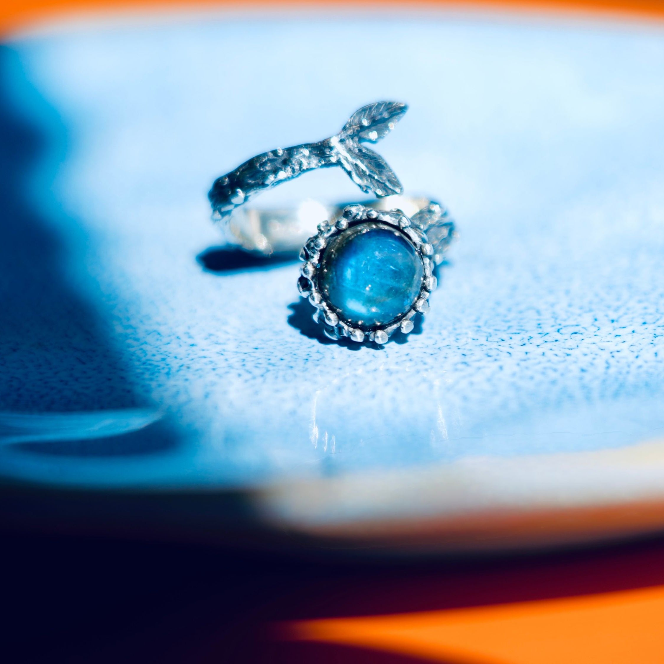 Clean front view labradorite ring blue stone silver statement jewelry minimal composition