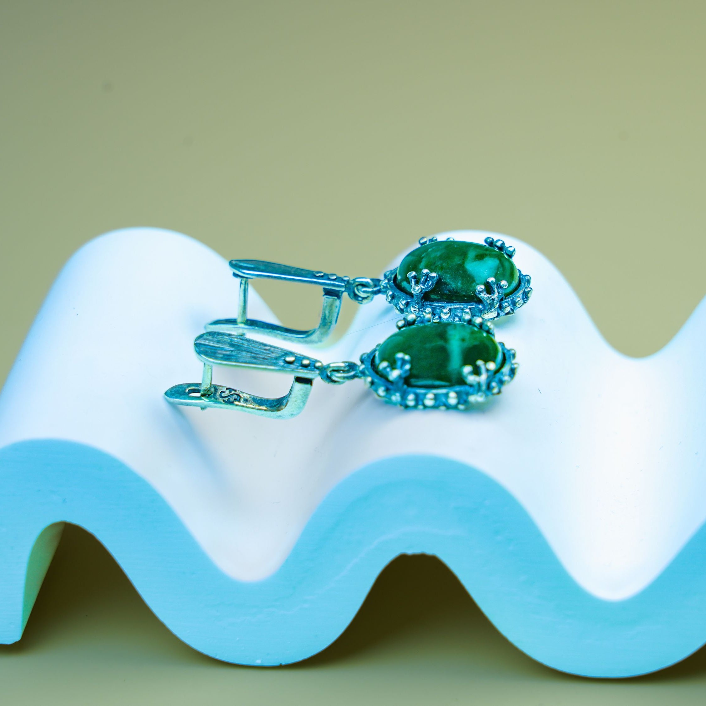 Jade earrings clean front view green gemstone silver earrings minimal composition