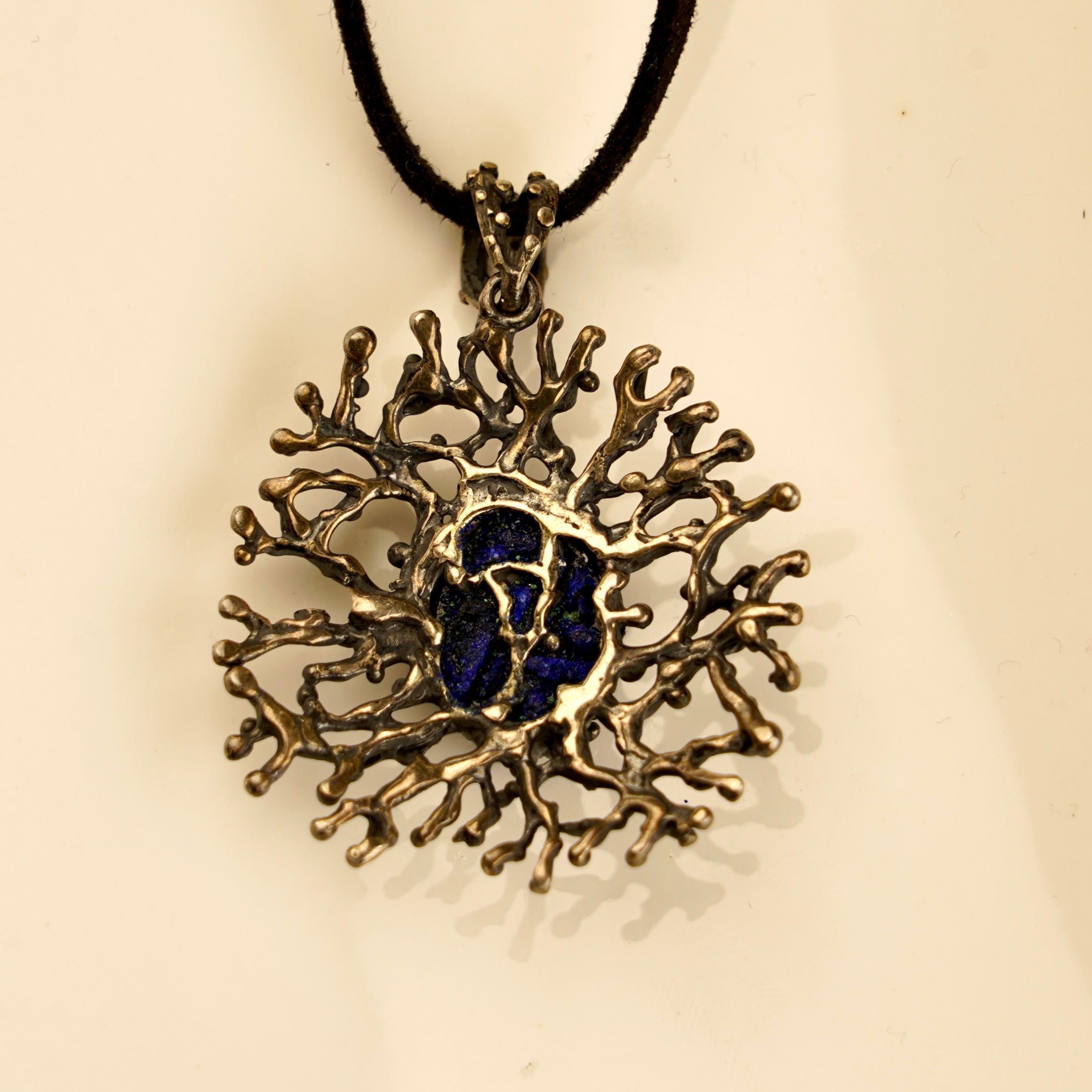 lapis lazuli pendant close up blue gemstone texture silver necklace