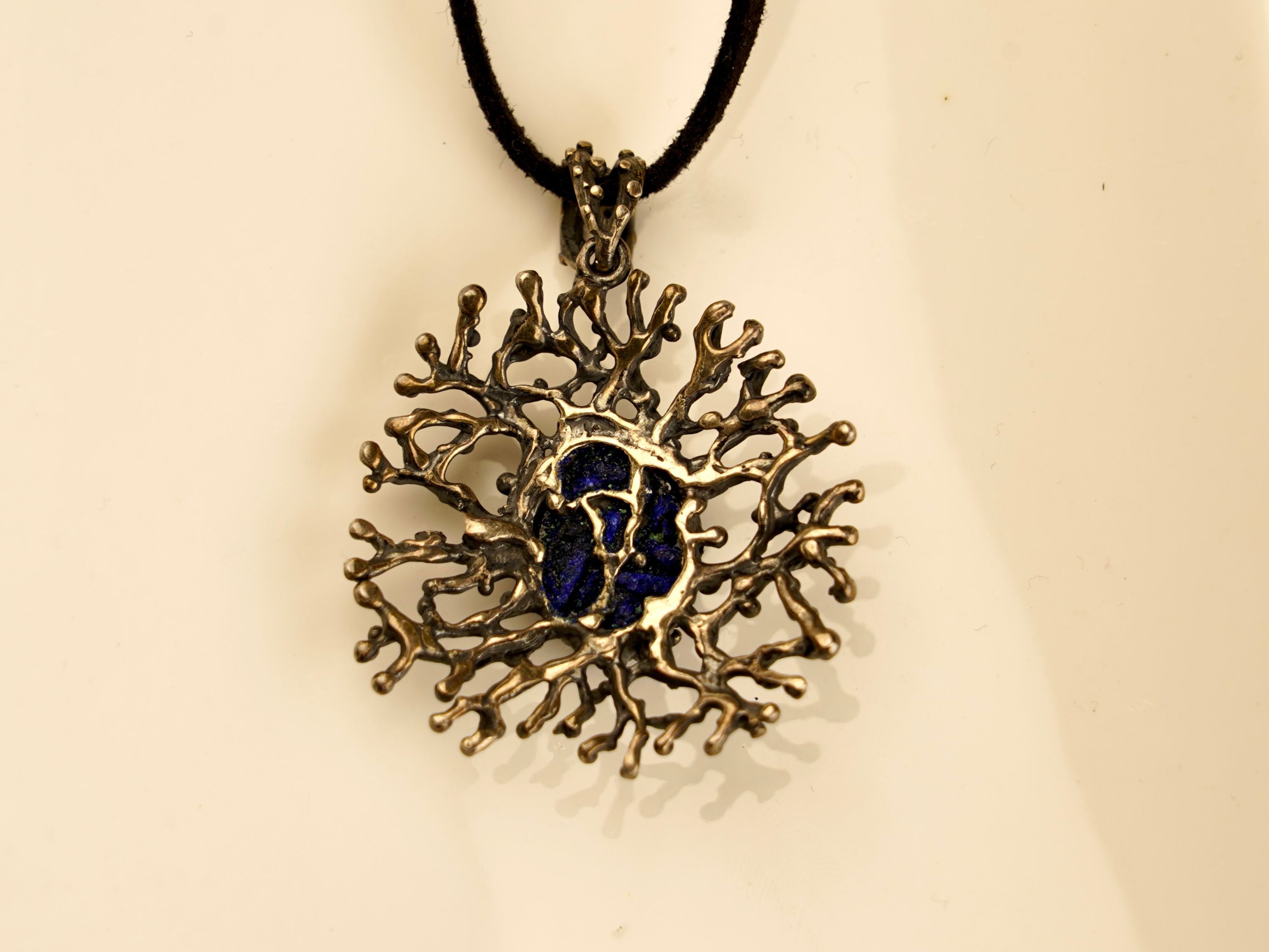 lapis lazuli pendant close up blue gemstone texture silver necklace