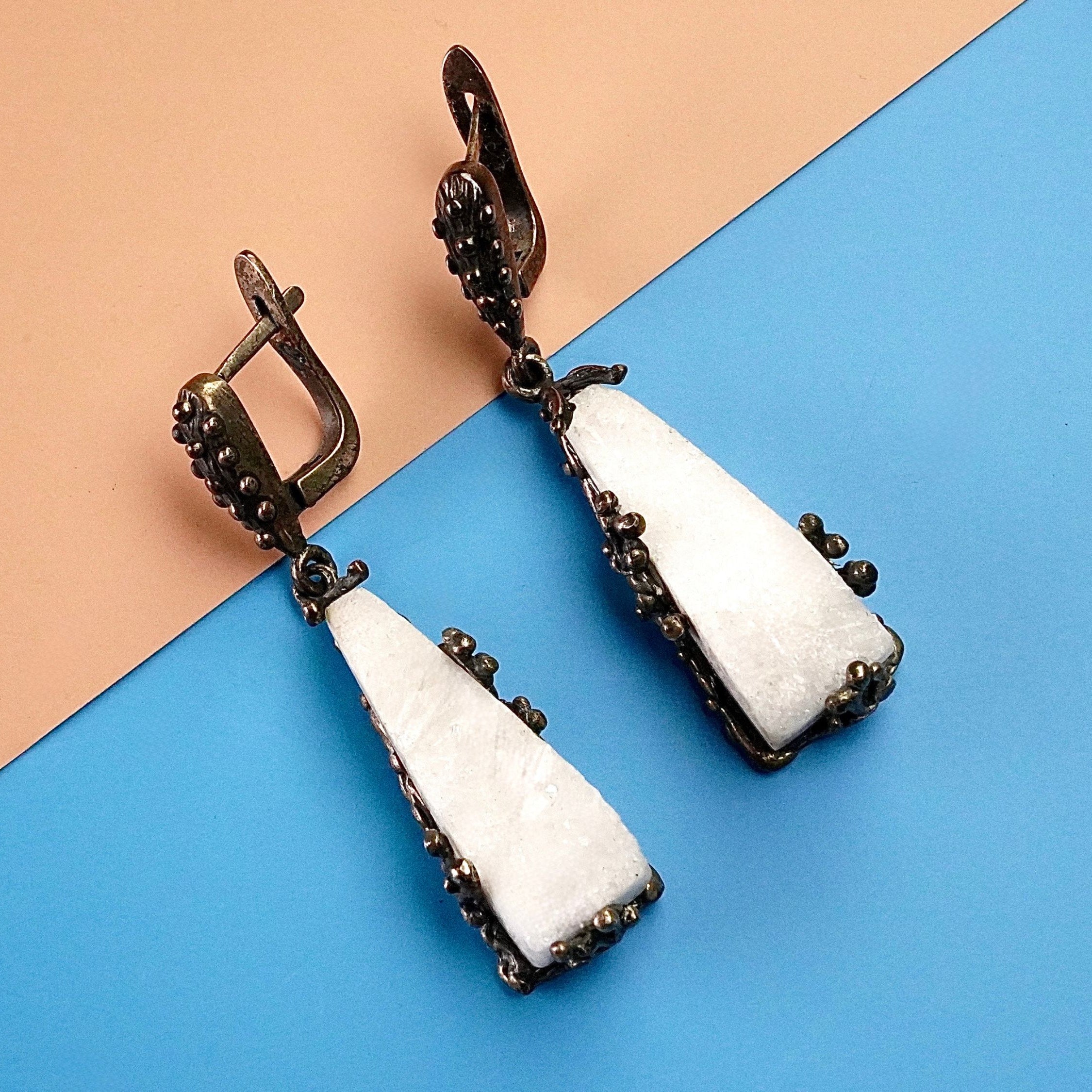 Moonstone earrings clean front view raw white crystal drop earrings minimal composition