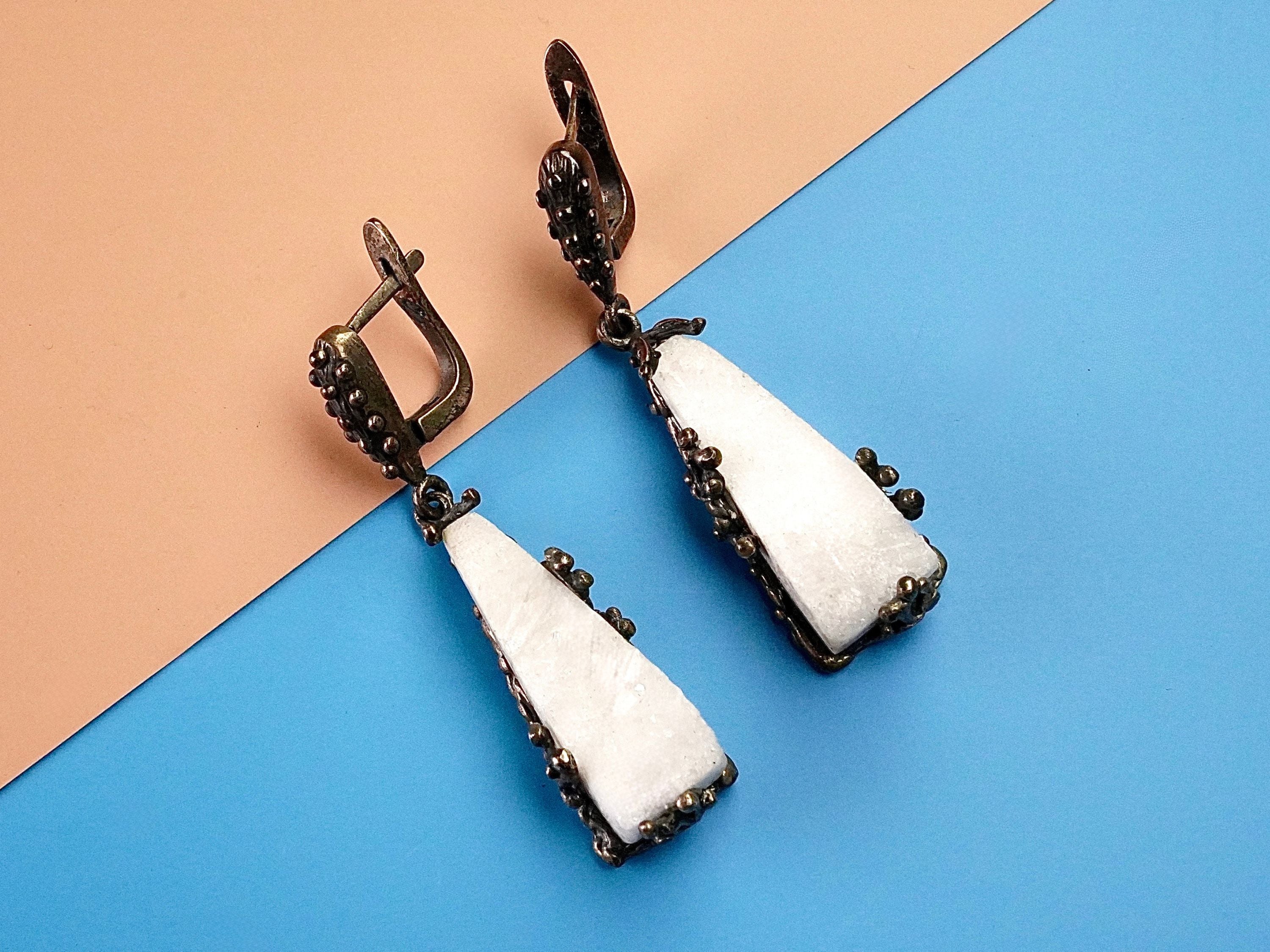 Moonstone earrings clean front view raw white crystal drop earrings minimal composition