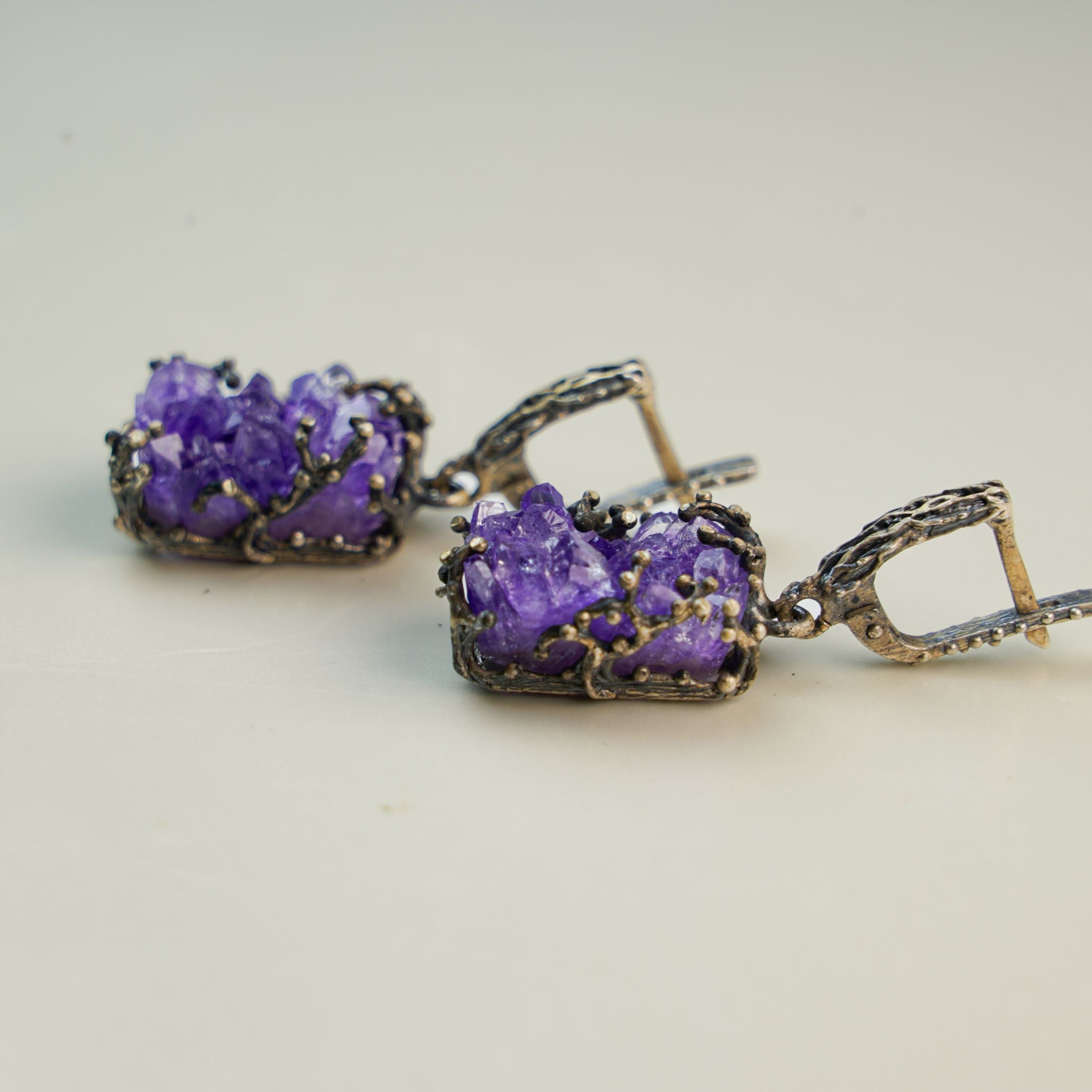 amethyst dangle earrings side angle purple gemstone elegant silver jewelry