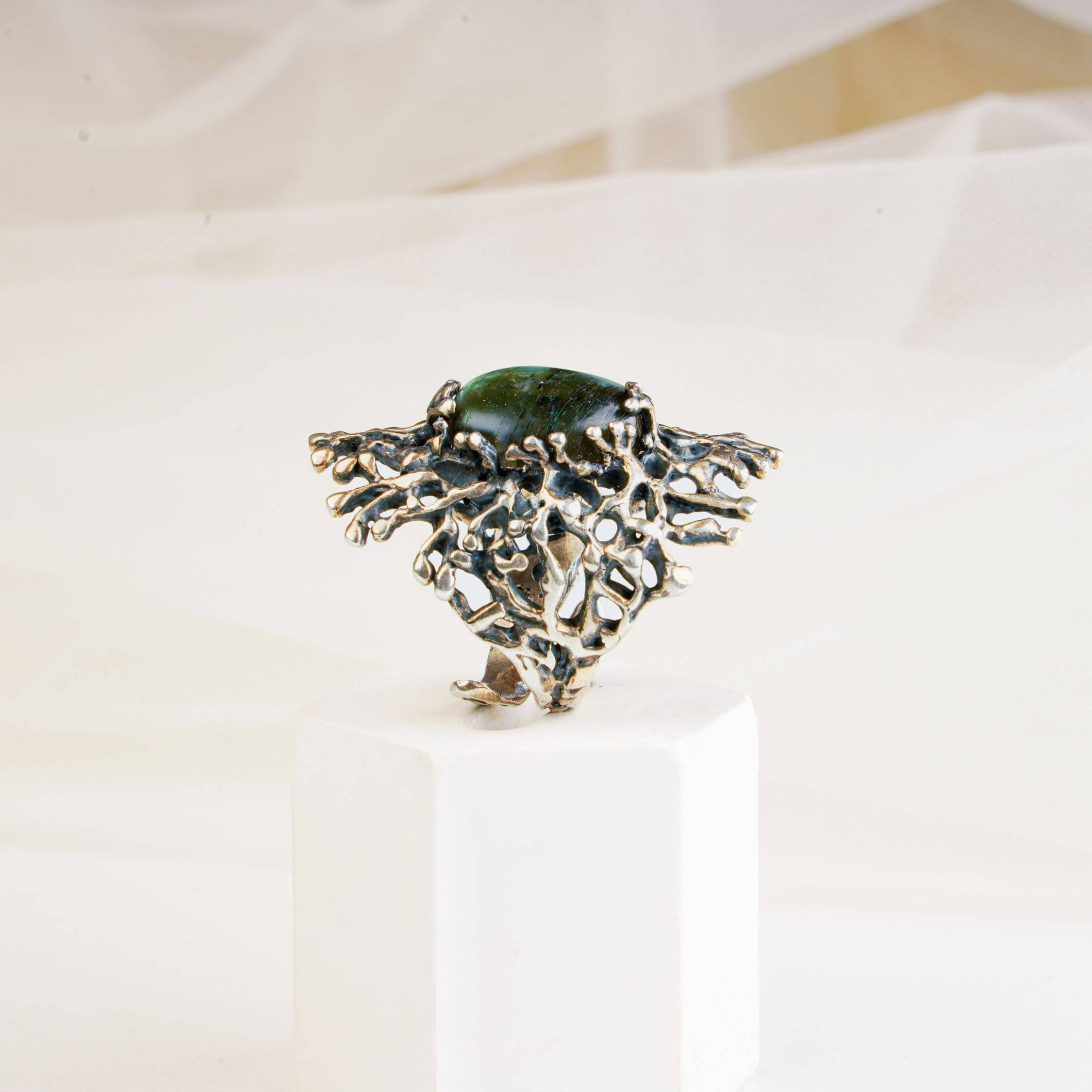 Side view of the high-set gothic labradorite ring showing the intricate silver branch-like texture