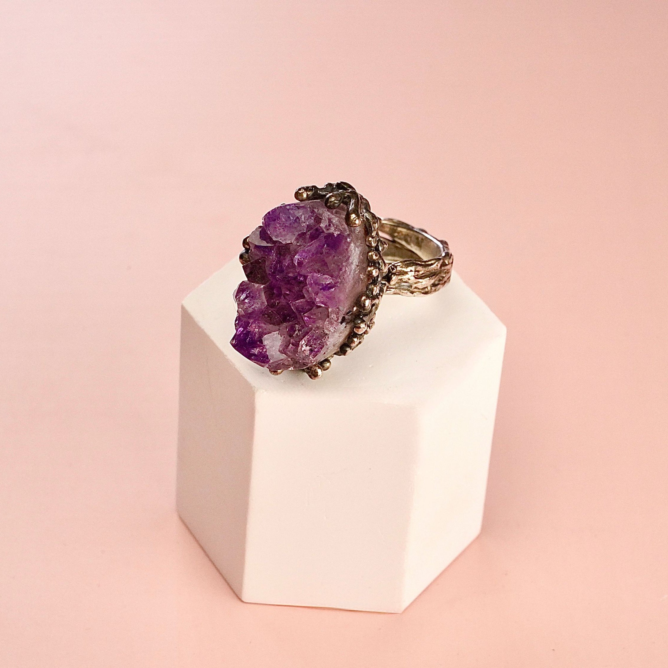 Clean front view amethyst ring raw purple crystal silver statement jewelry composition