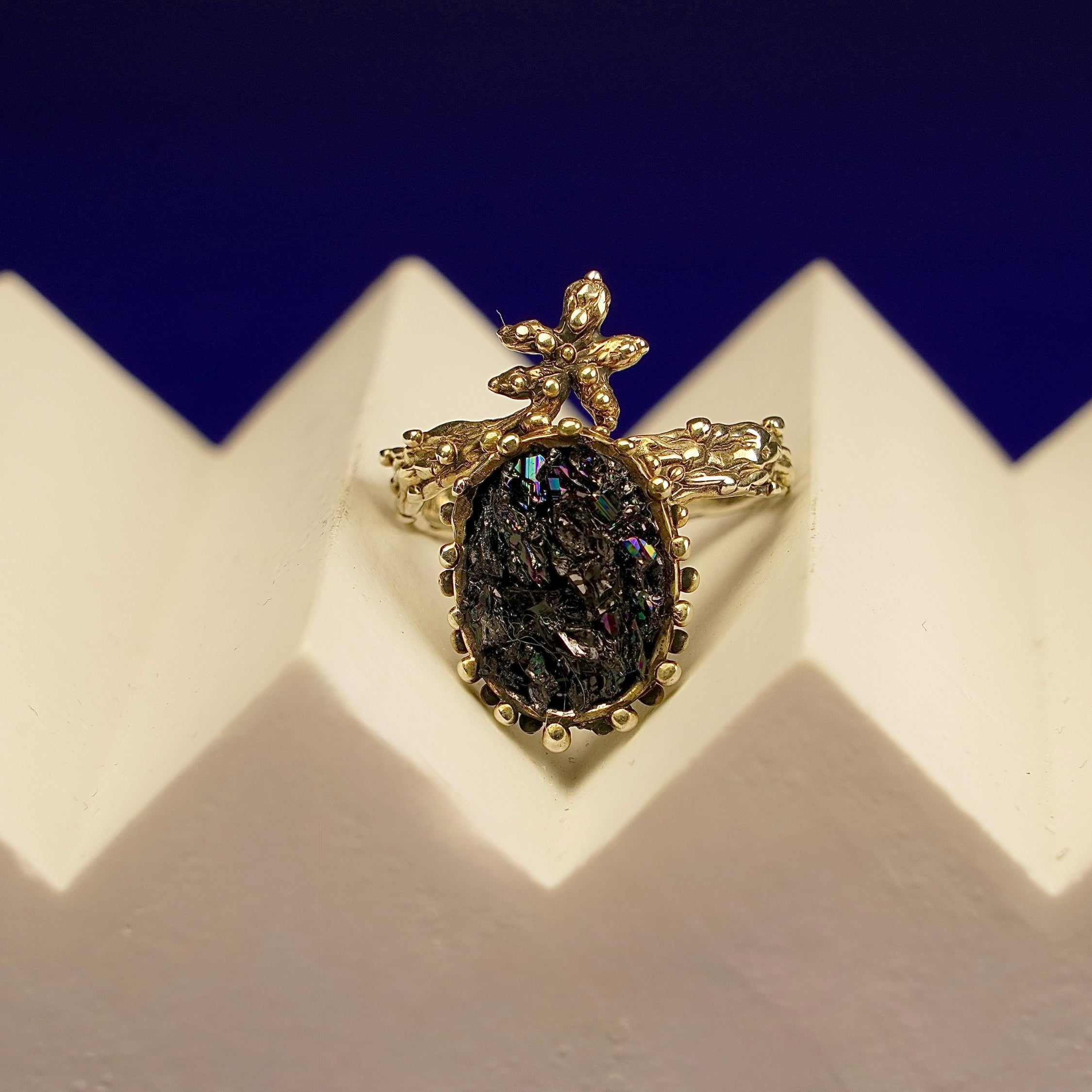 Clean front view ornate tourmaline ring crown design silver statement jewelry