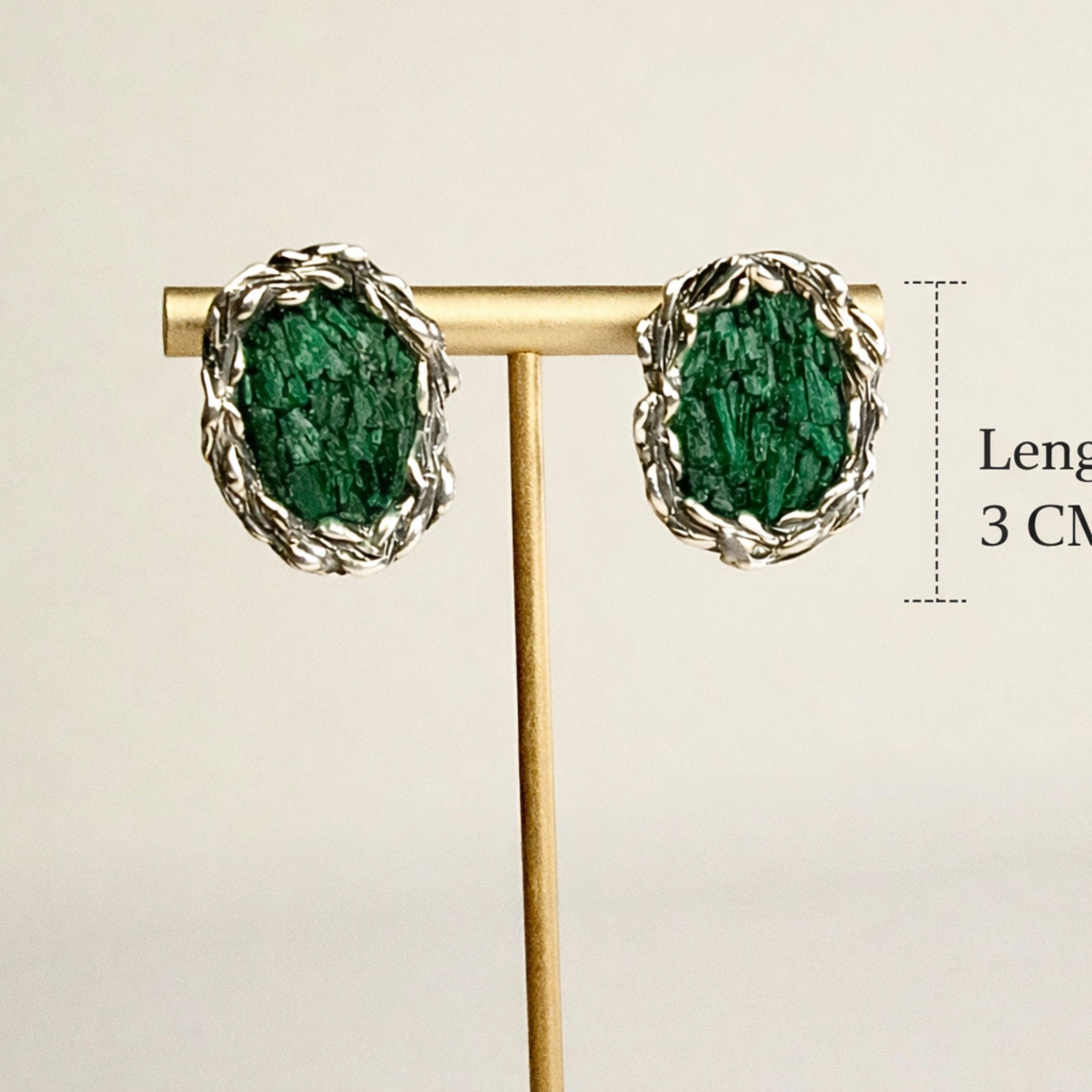 Angle view malachite earrings green stone silver earrings artistic composition
