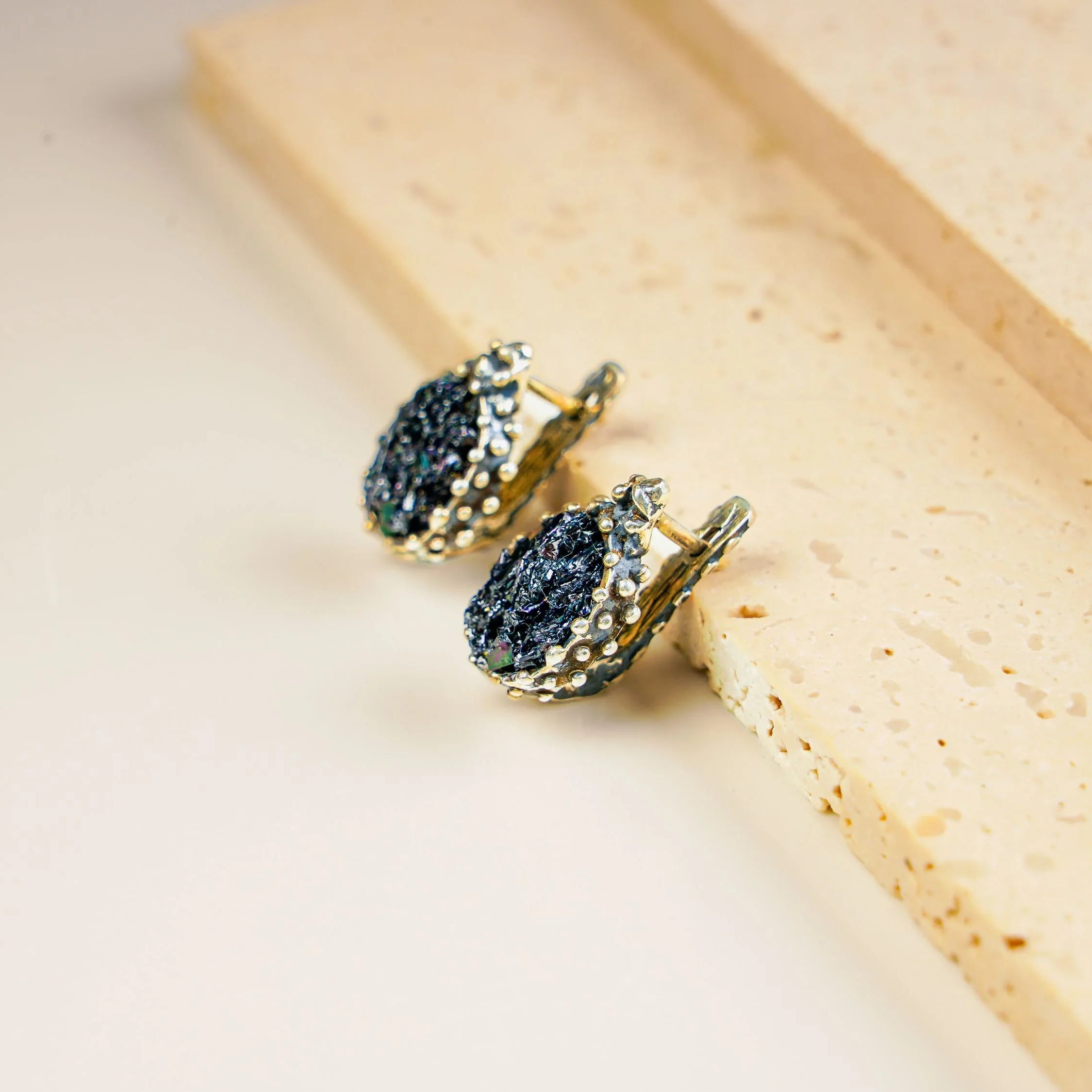 Black moissanite earrings angled view minimalist dark gemstone jewelry