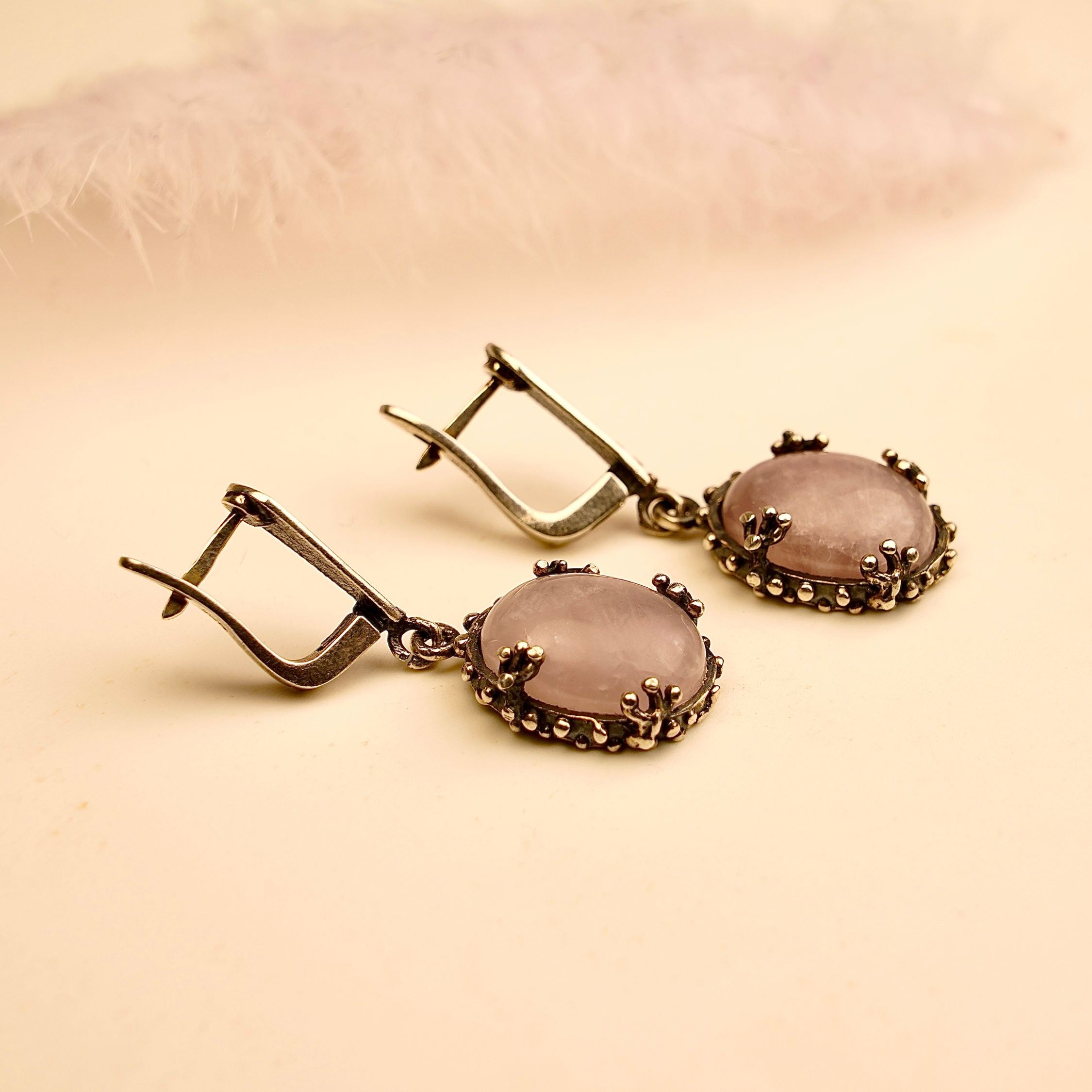 rose quartz earrings angled view, feminine pink gemstone jewelry