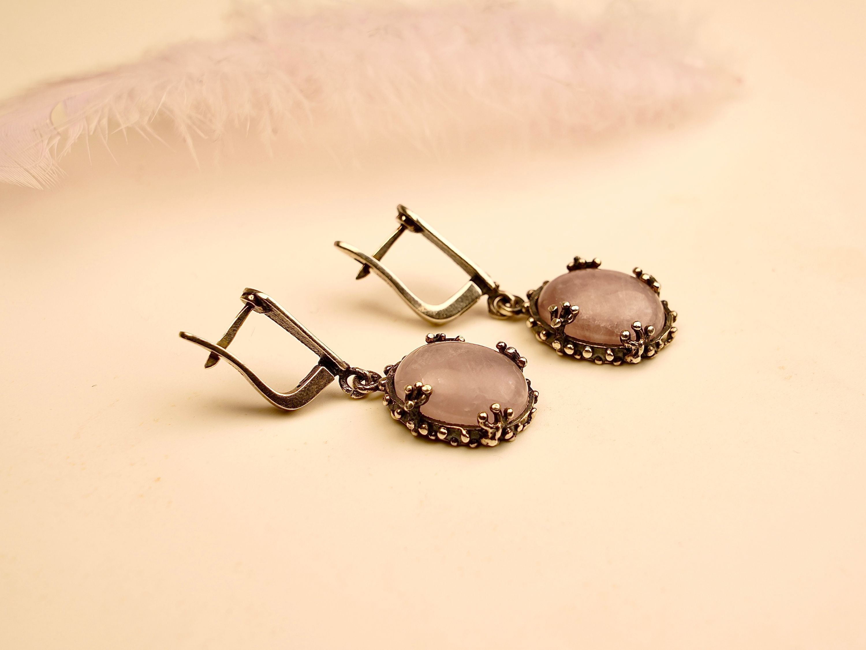 rose quartz earrings angled view, feminine pink gemstone jewelry