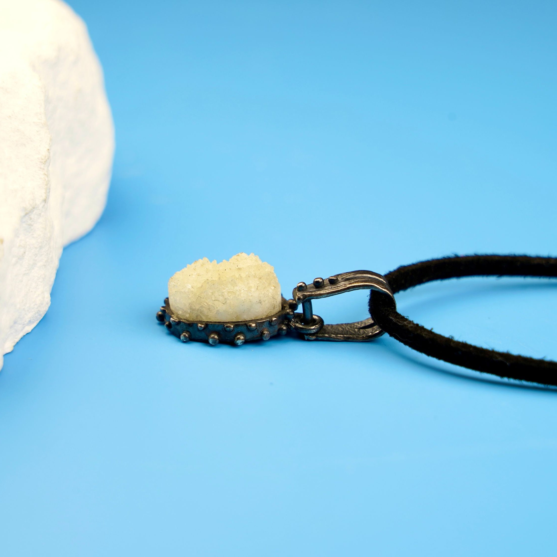 moonstone pendant side angle glowing gemstone silver design