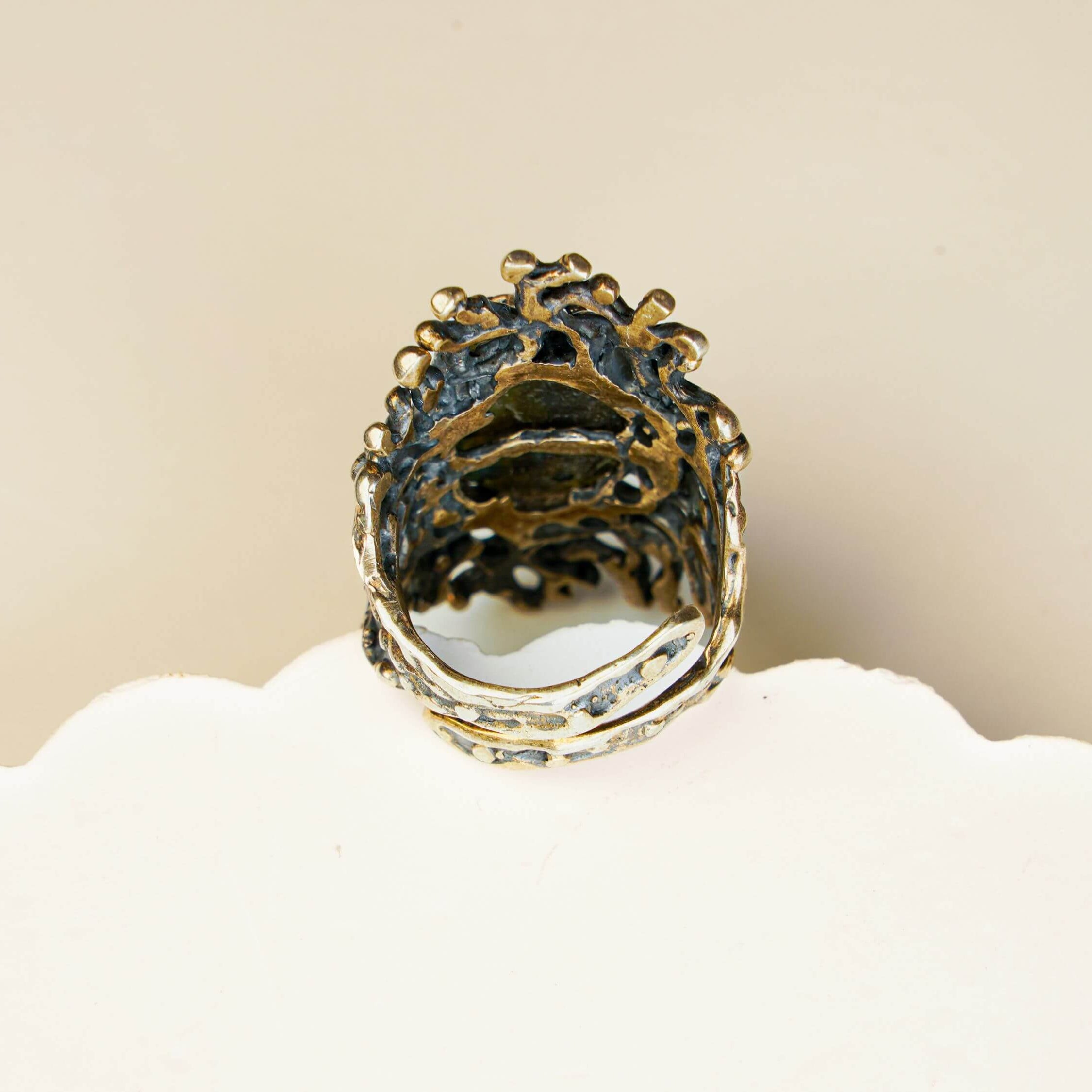 Detailed shot of the adjustable open-back silver band on the large labradorite statement ring