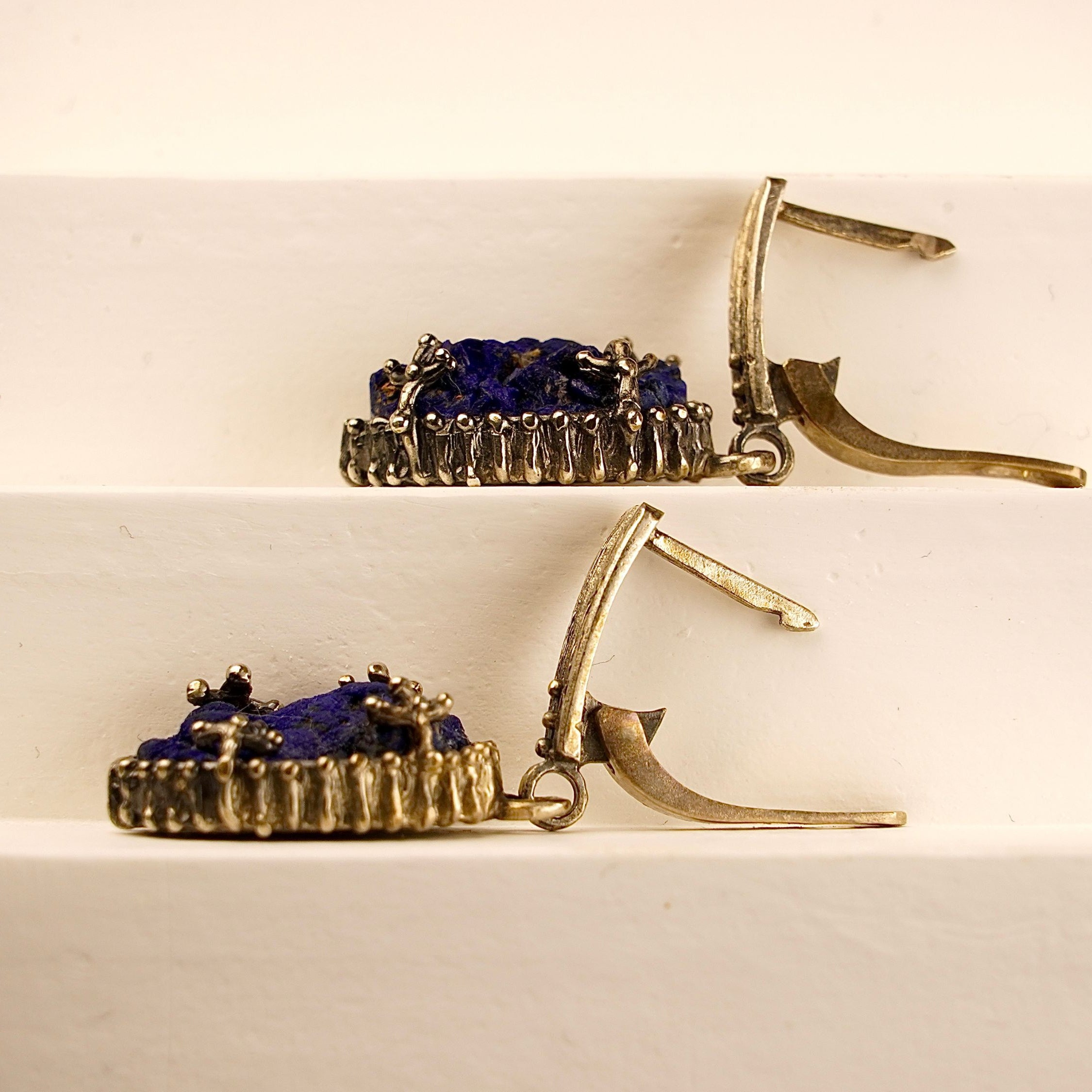 Angle view lapis lazuli earrings blue gemstone silver drop earrings perspective