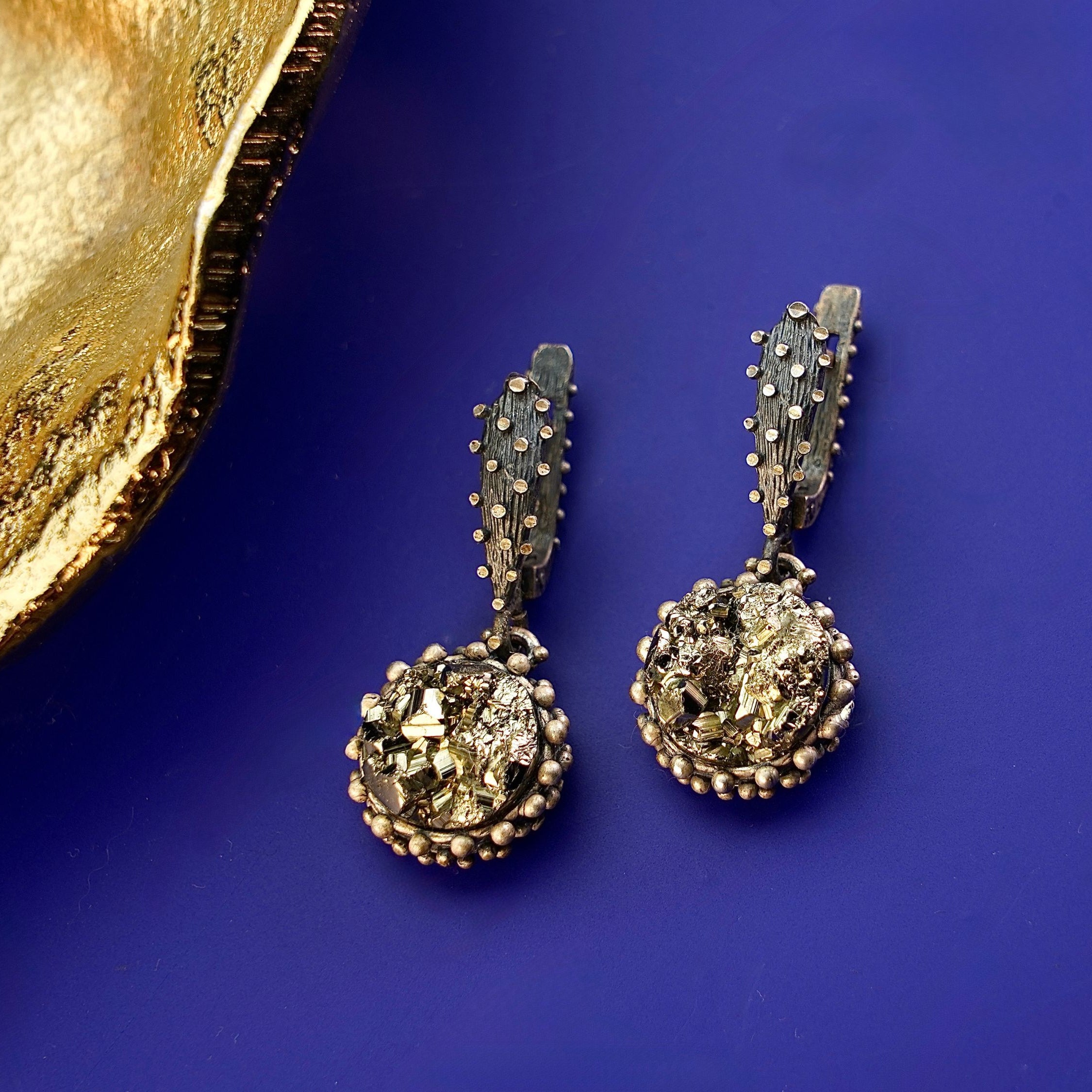 Angle view pyrite earrings metallic gold cluster silver earrings perspective