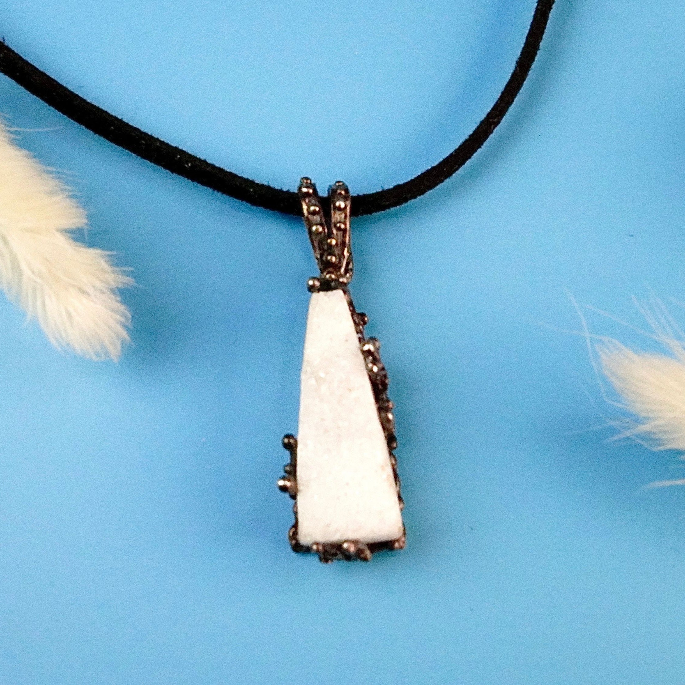 Angle view moonstone pendant raw white gemstone silver necklace elegant perspective