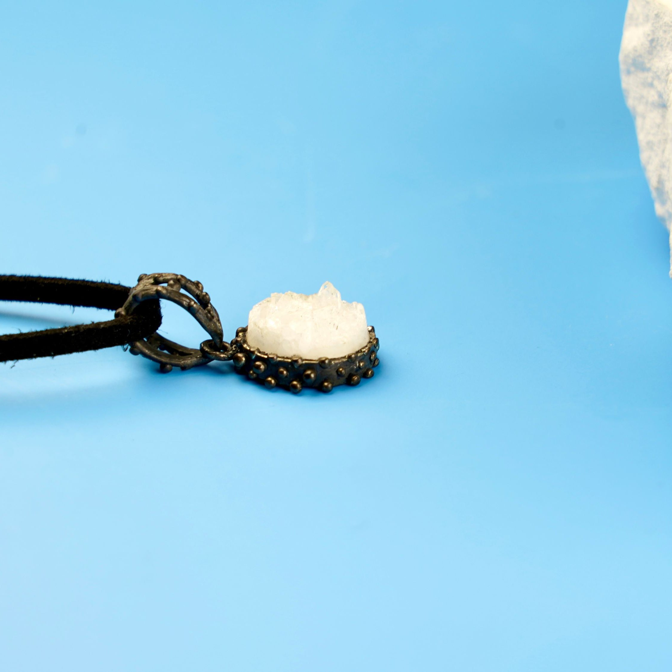 moonstone pendant side profile, gemstone depth and silver setting detail