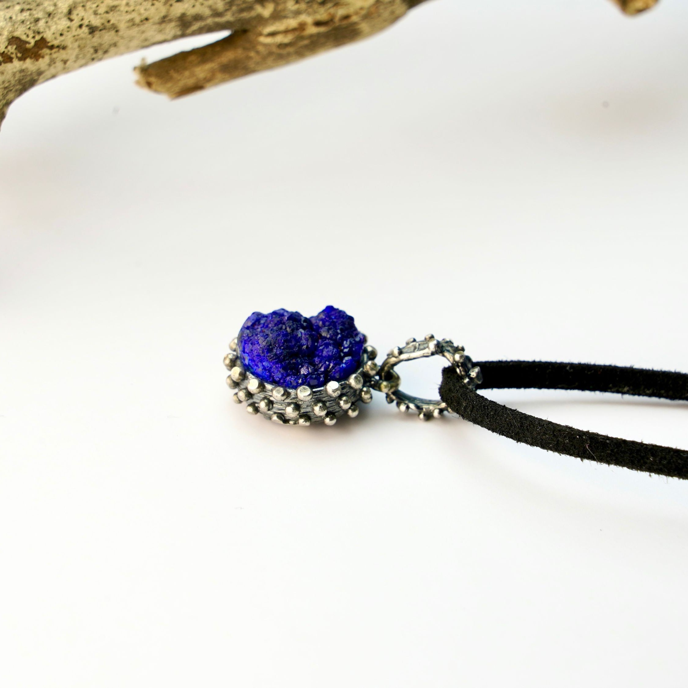 lapis lazuli pendant side profile, polished gemstone and silver setting