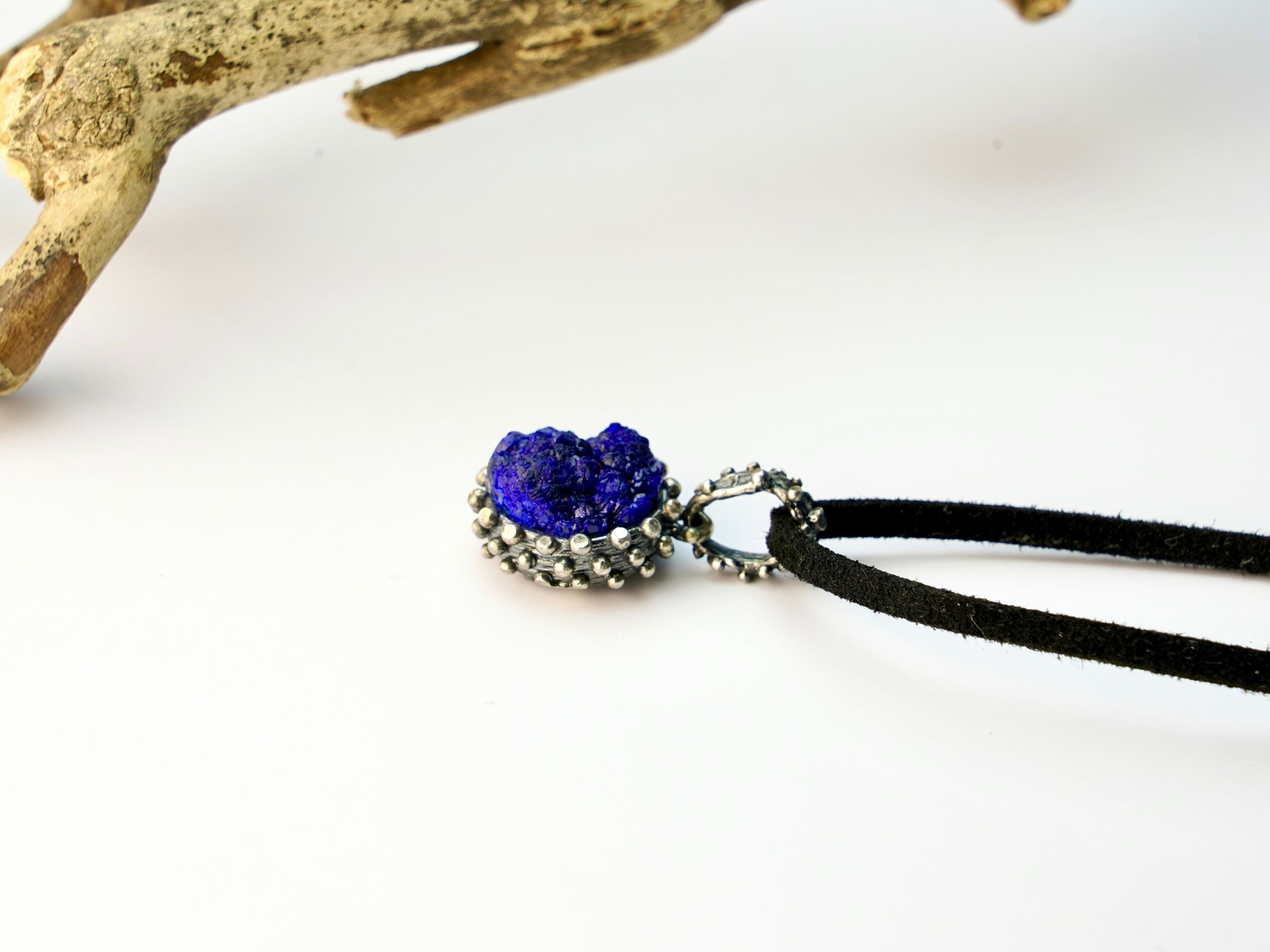 lapis lazuli pendant side profile, polished gemstone and silver setting