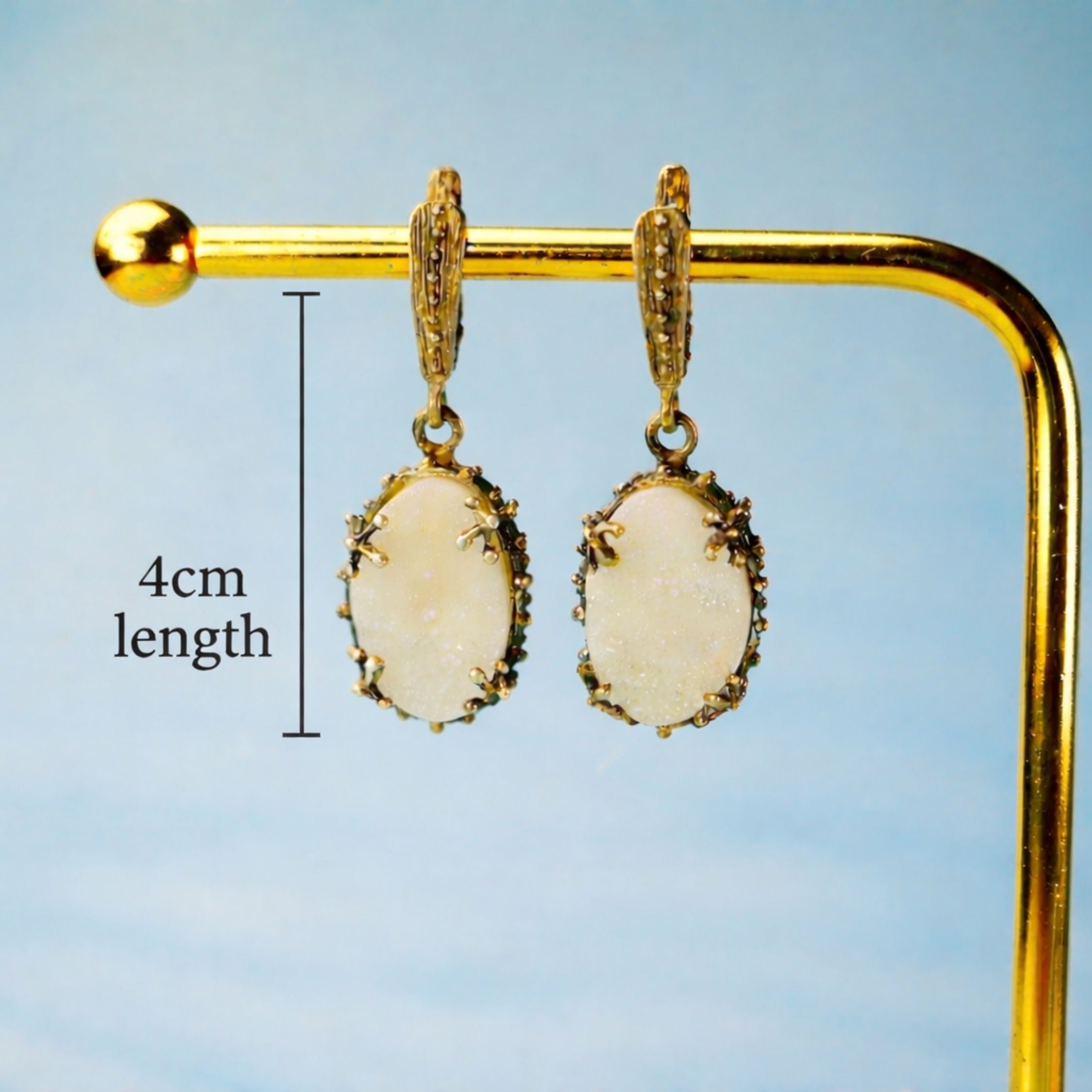 Side profile moonstone drop earrings length and structure silver earrings detail