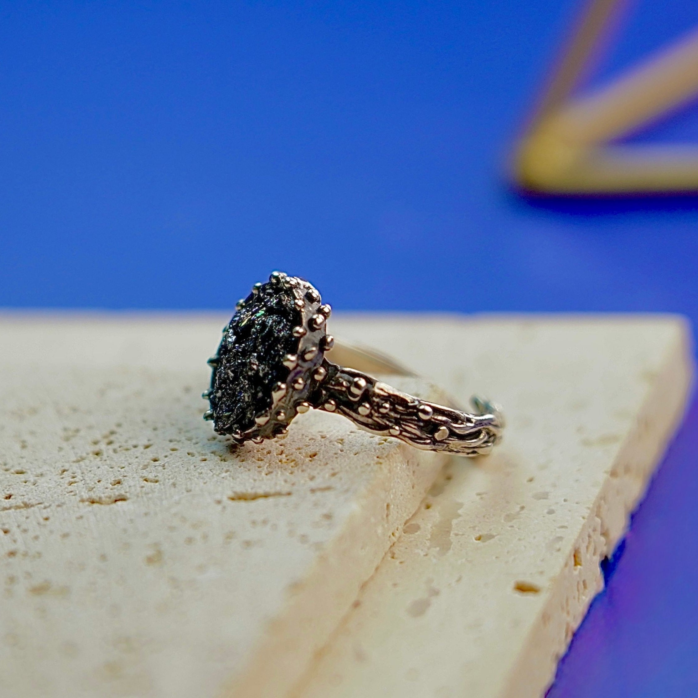 Side profile raw tourmaline ring adjustable band structure sterling silver detail
